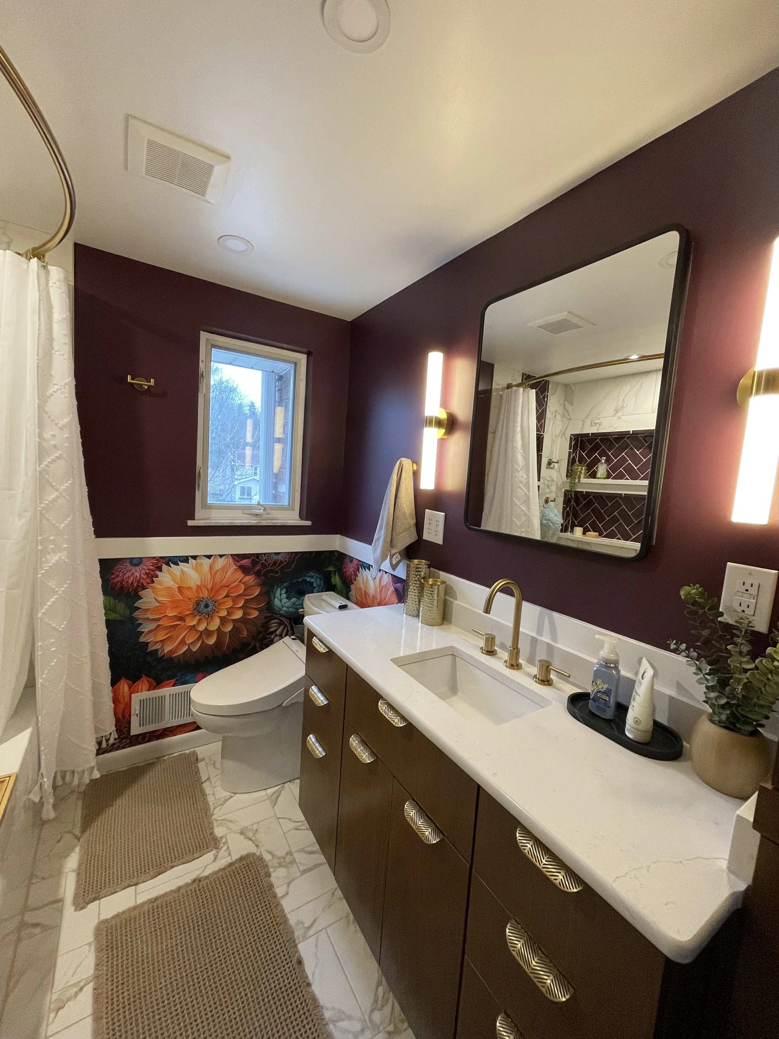 North Hills Primary Bath renovation featuring custom vanity, bold wall covering and beautiful gold details.