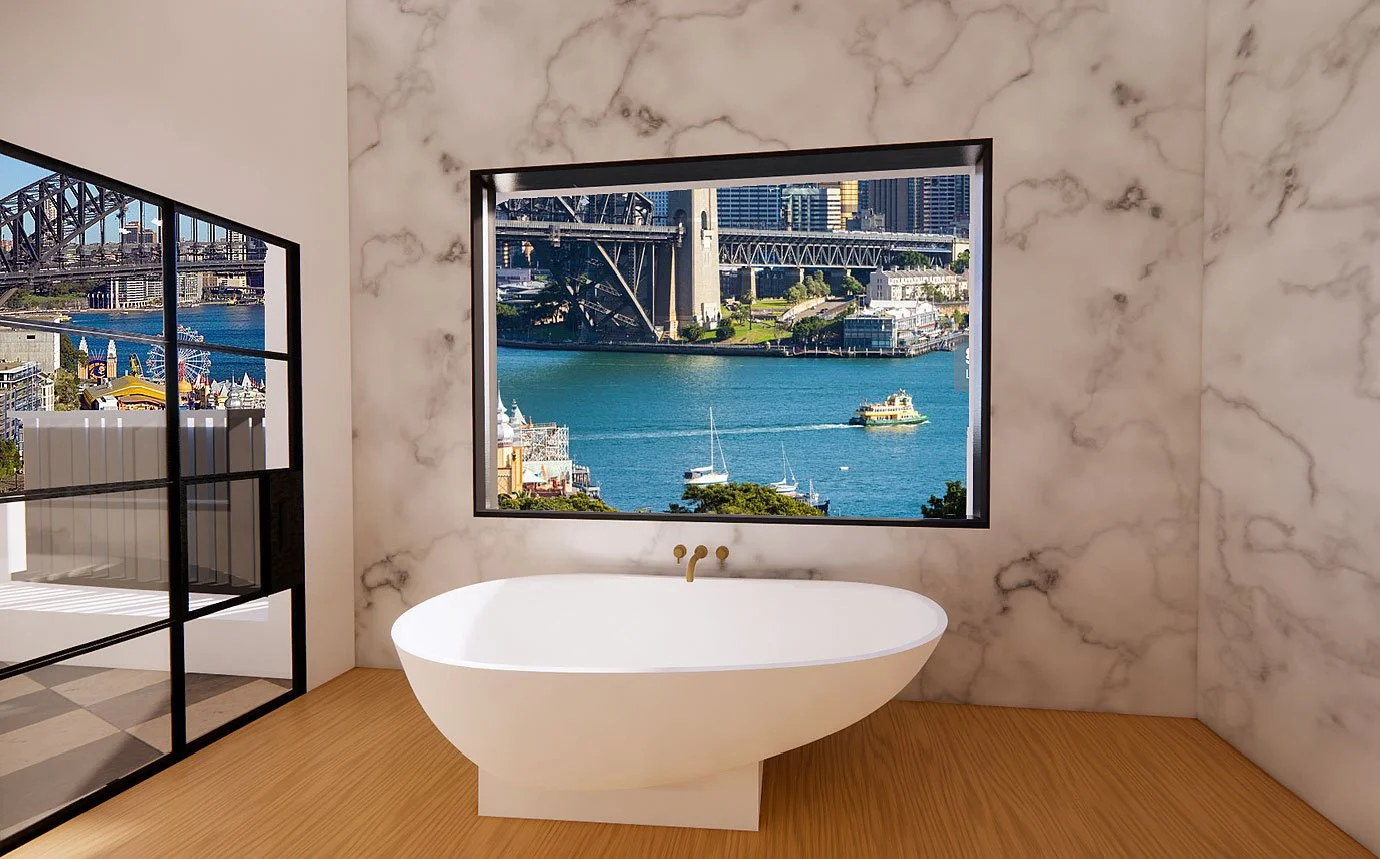 Natural stone and clean detailing elevate the bathroom into a calming, spa-like sanctuary.