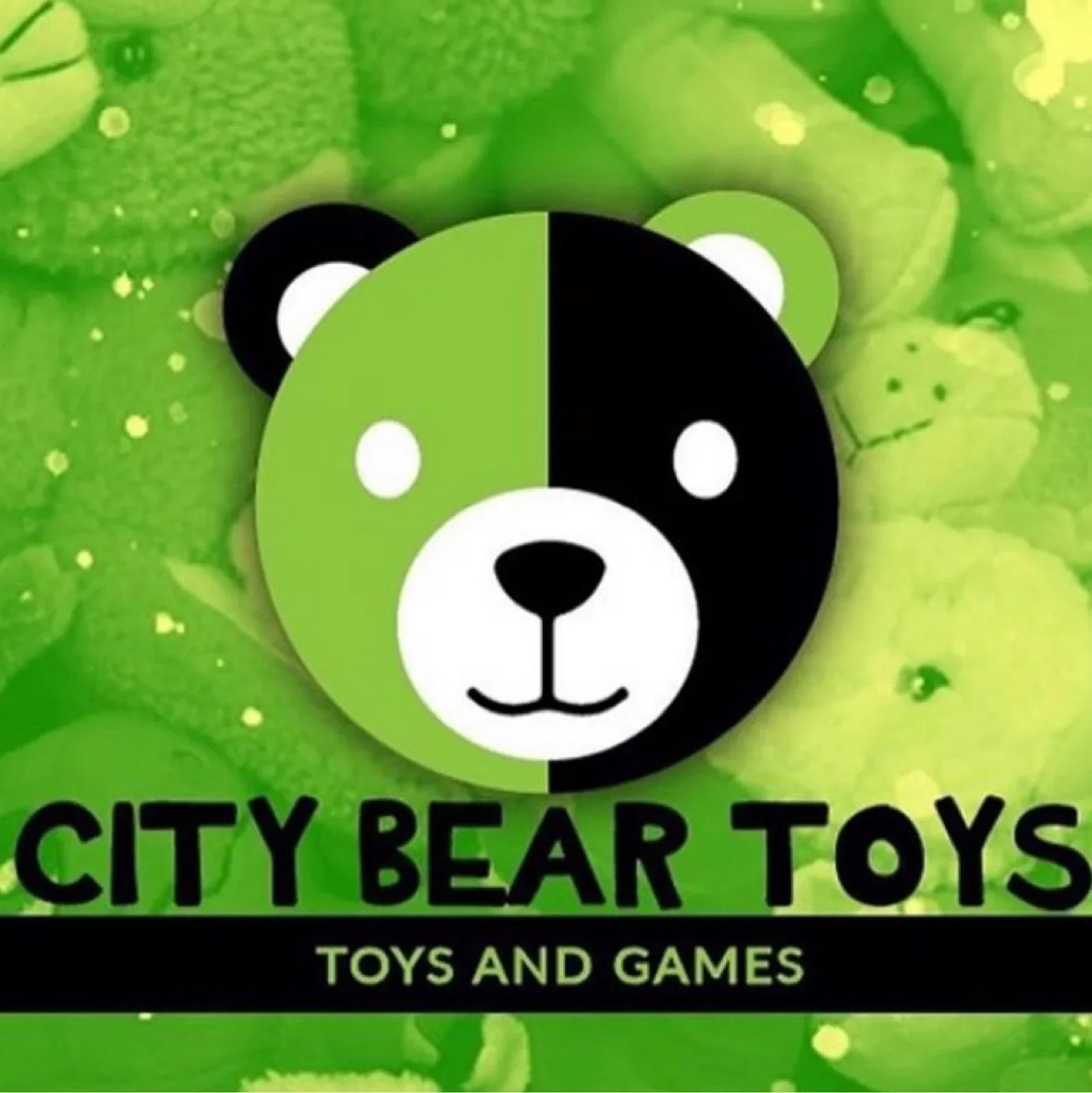 The logo of City Bear Toys, featuring a bear's face split into green and black halves with a background of green splashes and the text 'City Bear Toys Toys and Games'.