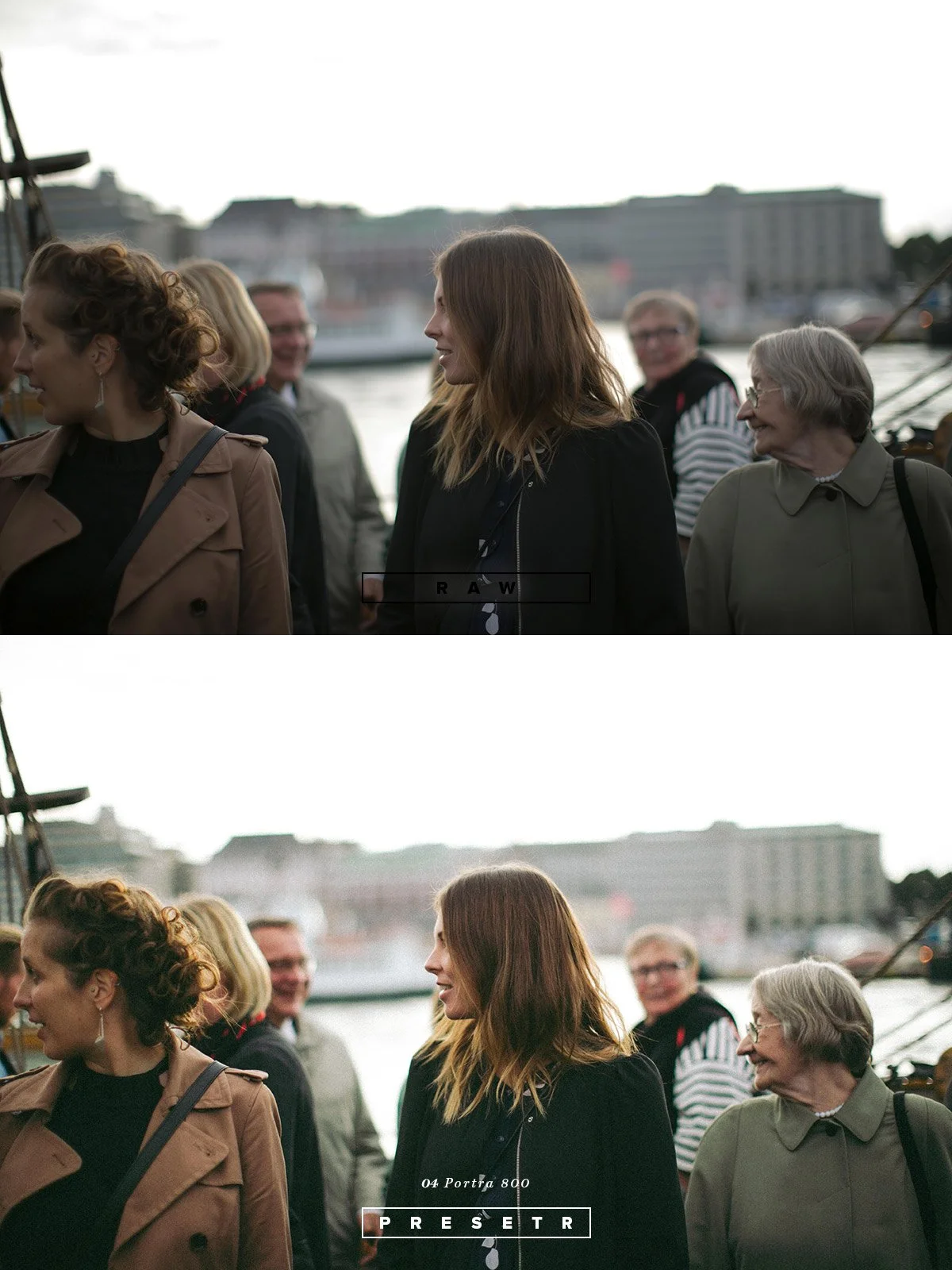 Group of people standing outdoors near water with city buildings in the background, engaged in conversation.
