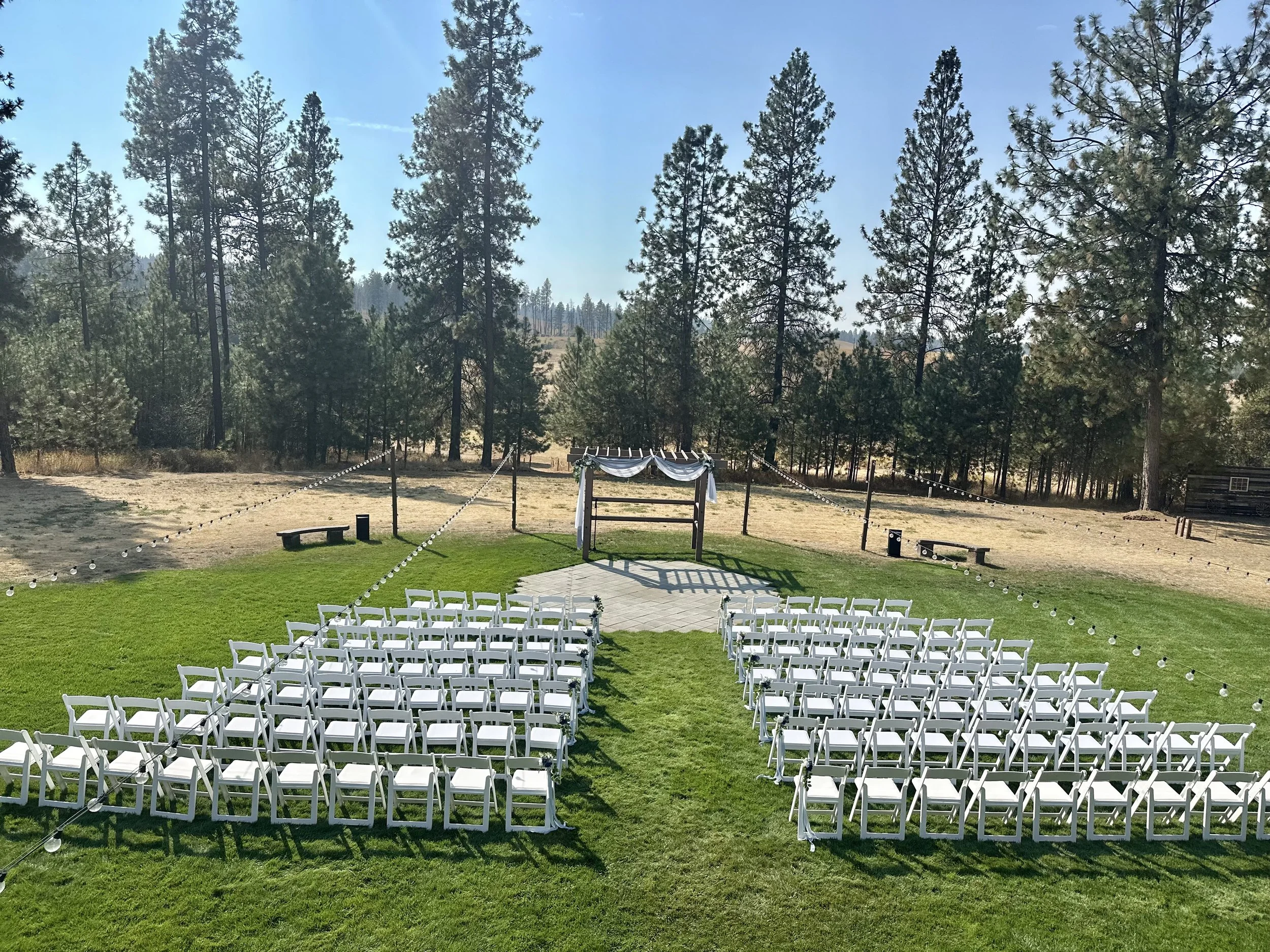 white chairs outside wedding ceremony
