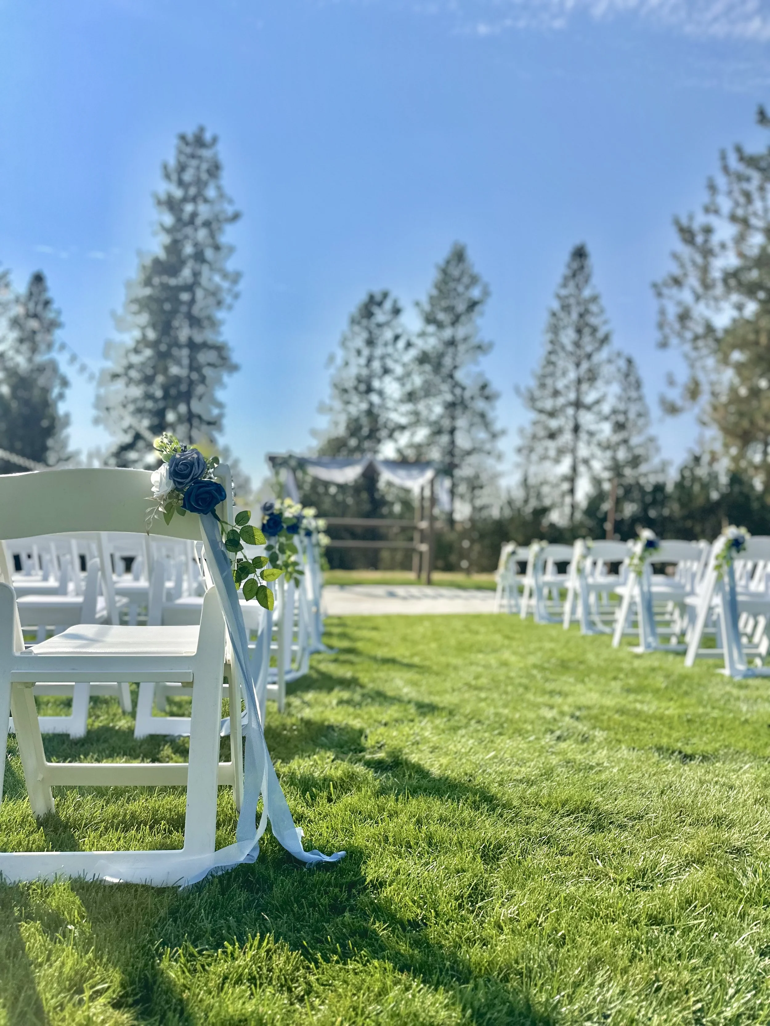 white chairs outside wedding ceremony
