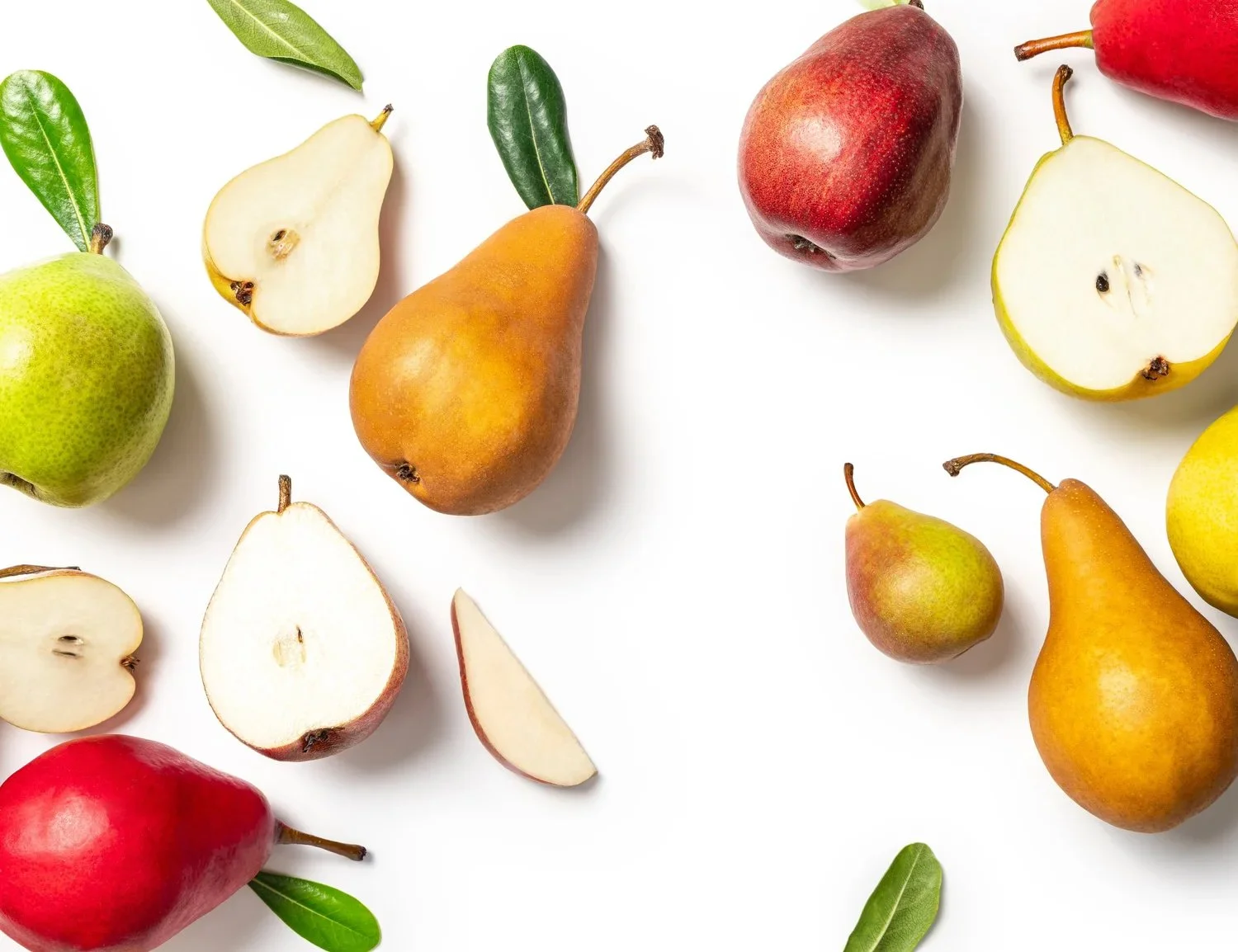 Commercial food photography for CMI Orchards and Julee Ho Media. A clean overhead flat lay of fresh whole and sliced red, green, and Bosc pears with green leaves arranged beautifully on a crisp white background.