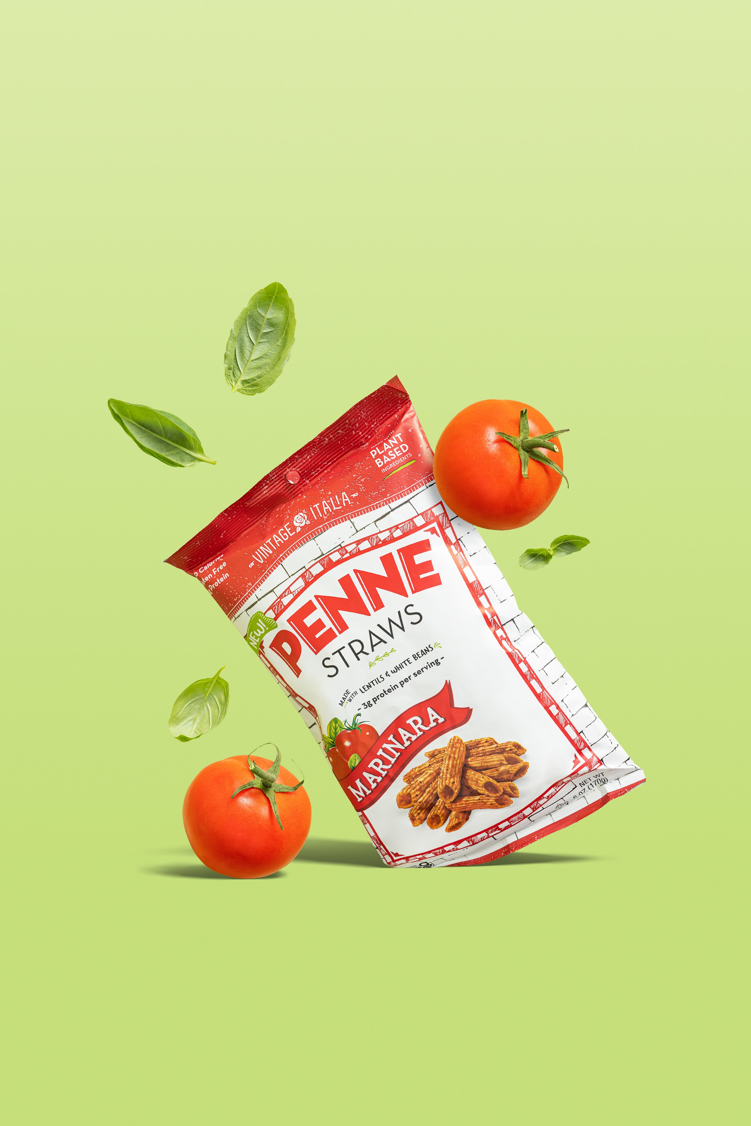 High-speed commercial food styling of a savory snack product. Sharp studio lighting captures floating ingredients like ripe tomatoes, fresh basil leaves, and salt crystals in mid-air motion against a bold green backdrop.