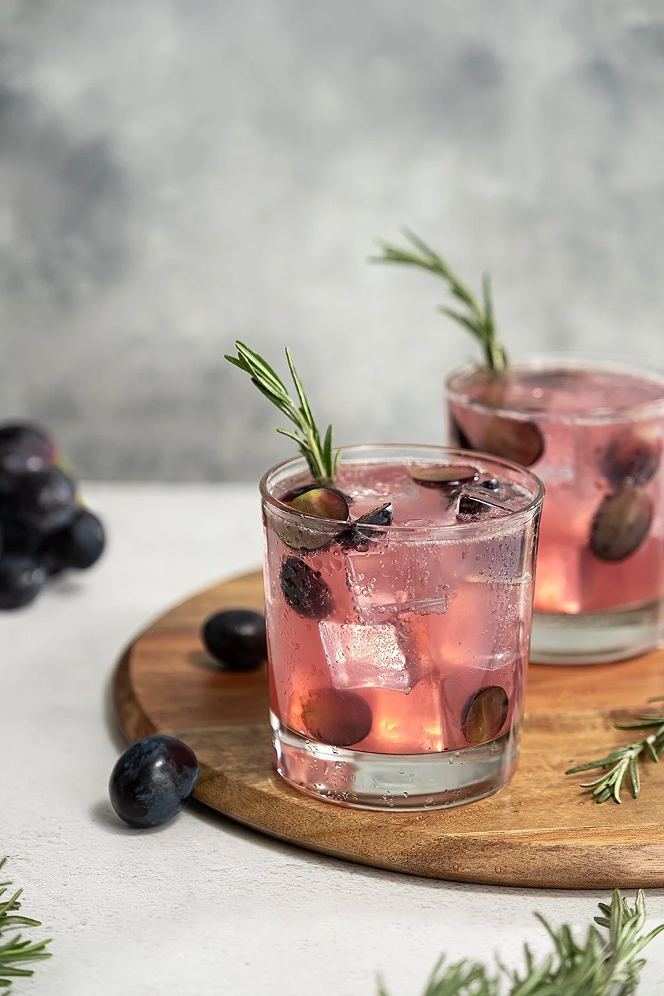 Commercial beverage photography for Jasmine Vineyards featuring the Jasmine 75 cocktail. An elegant sparkling drink beautifully styled on a warm surface for a winery brand campaign.