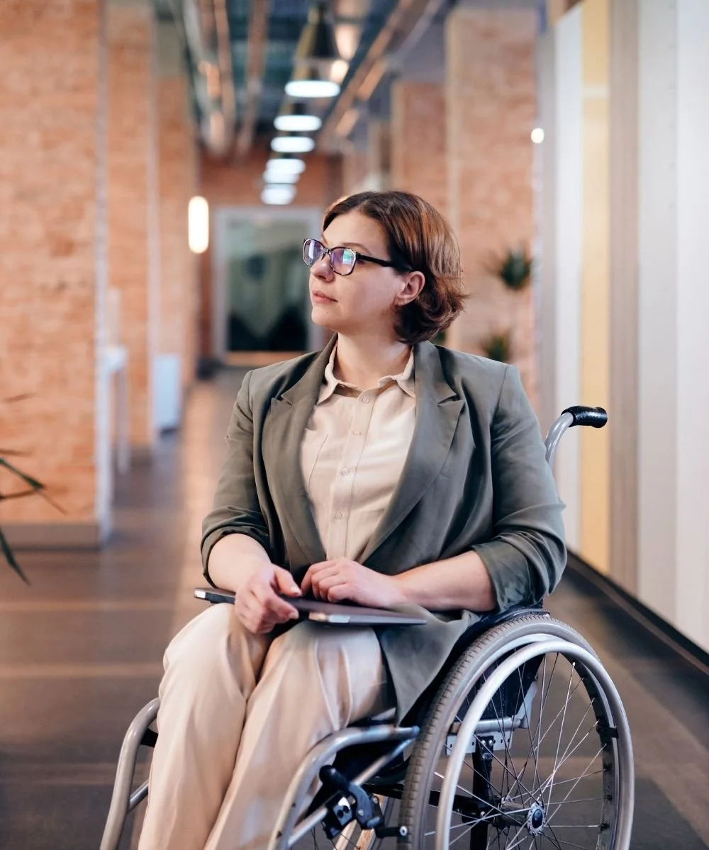 Woman in a wheelchair at the workplace
