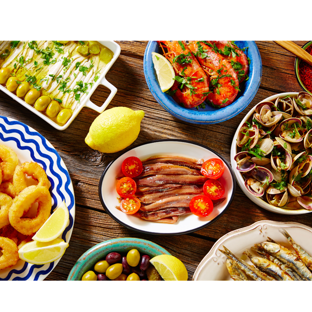 Spread of Spanish tapas with olives, anchovies, calamari and seafood
