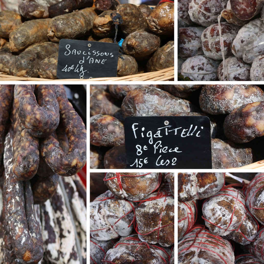A photo grid collage displaying various traditional cured sausages and meats for sale with handwritten price signs at a local French market.