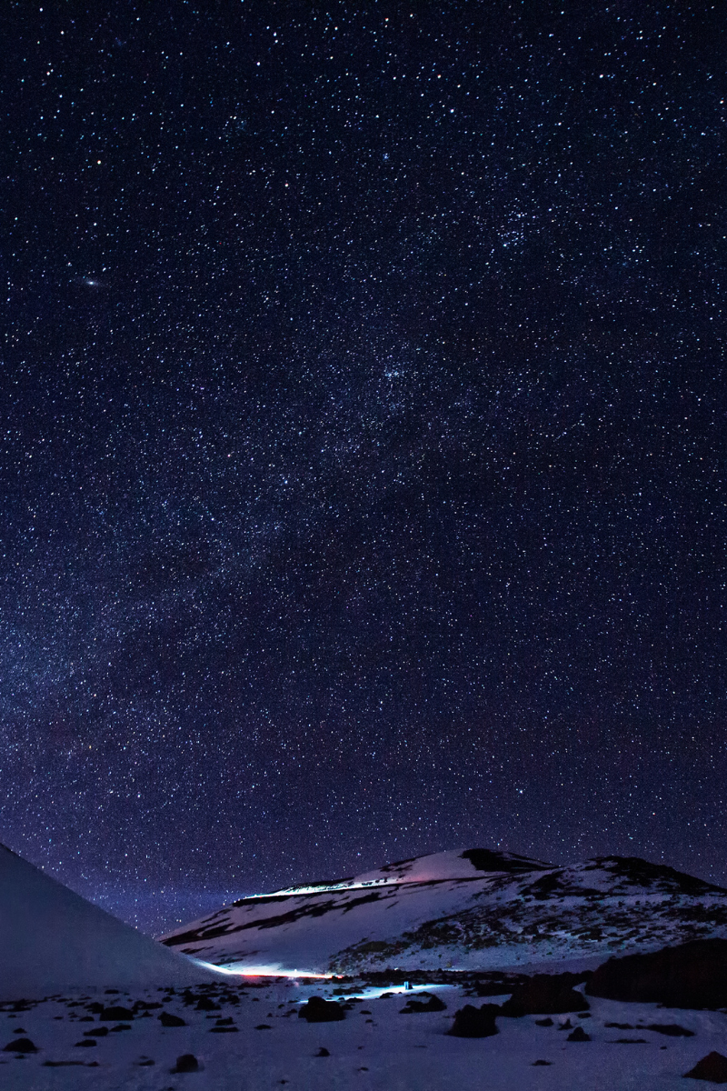 Star-filled night sky above a mountain summit on the Island of Hawaii