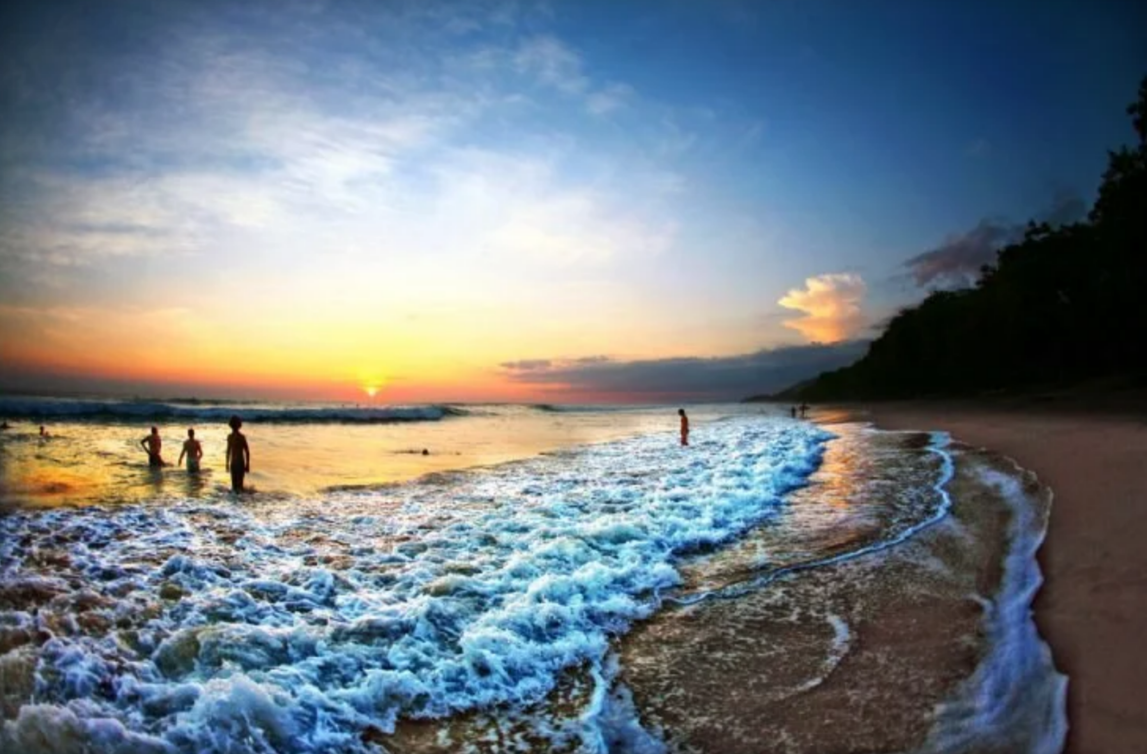 Watch a breathtaking golden sunset over a tropical Costa Rican beach. Experience the perfect evening of swimming and relaxing in the warm ocean waves.