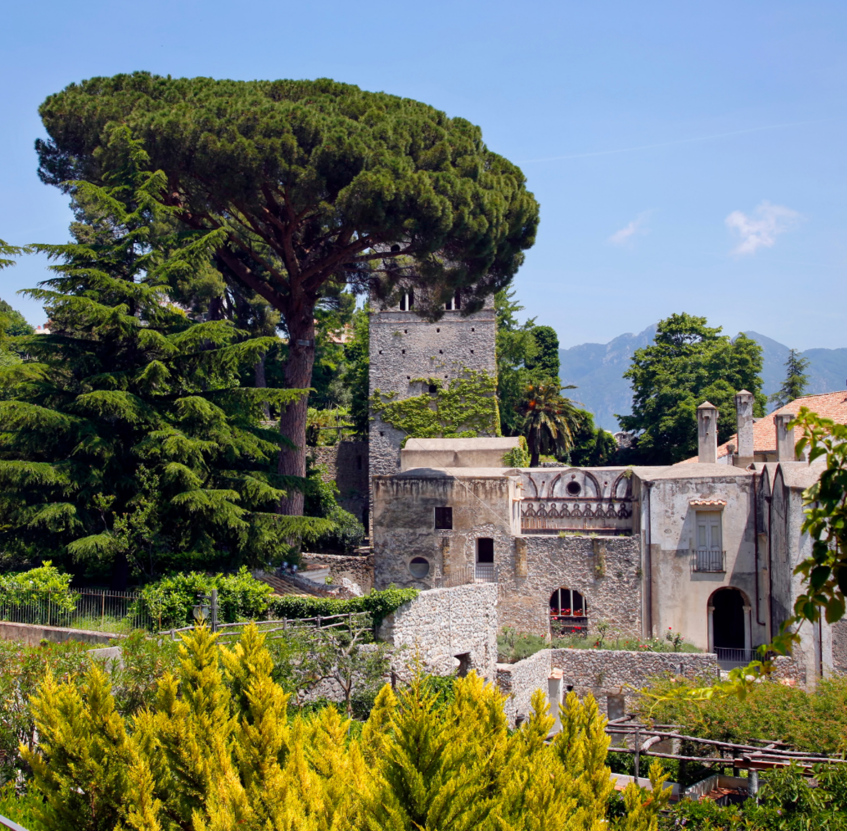 Historic Villa Rufolo in Ravello, Italy, featuring lush gardens, ancient stone architecture, and scenic terraces overlooking the Amalfi Coast, a primary venue of the Ravello Music and Arts Festival.