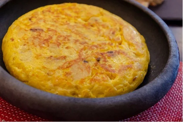 Spanish tortilla (potato omelet) in a clay dish