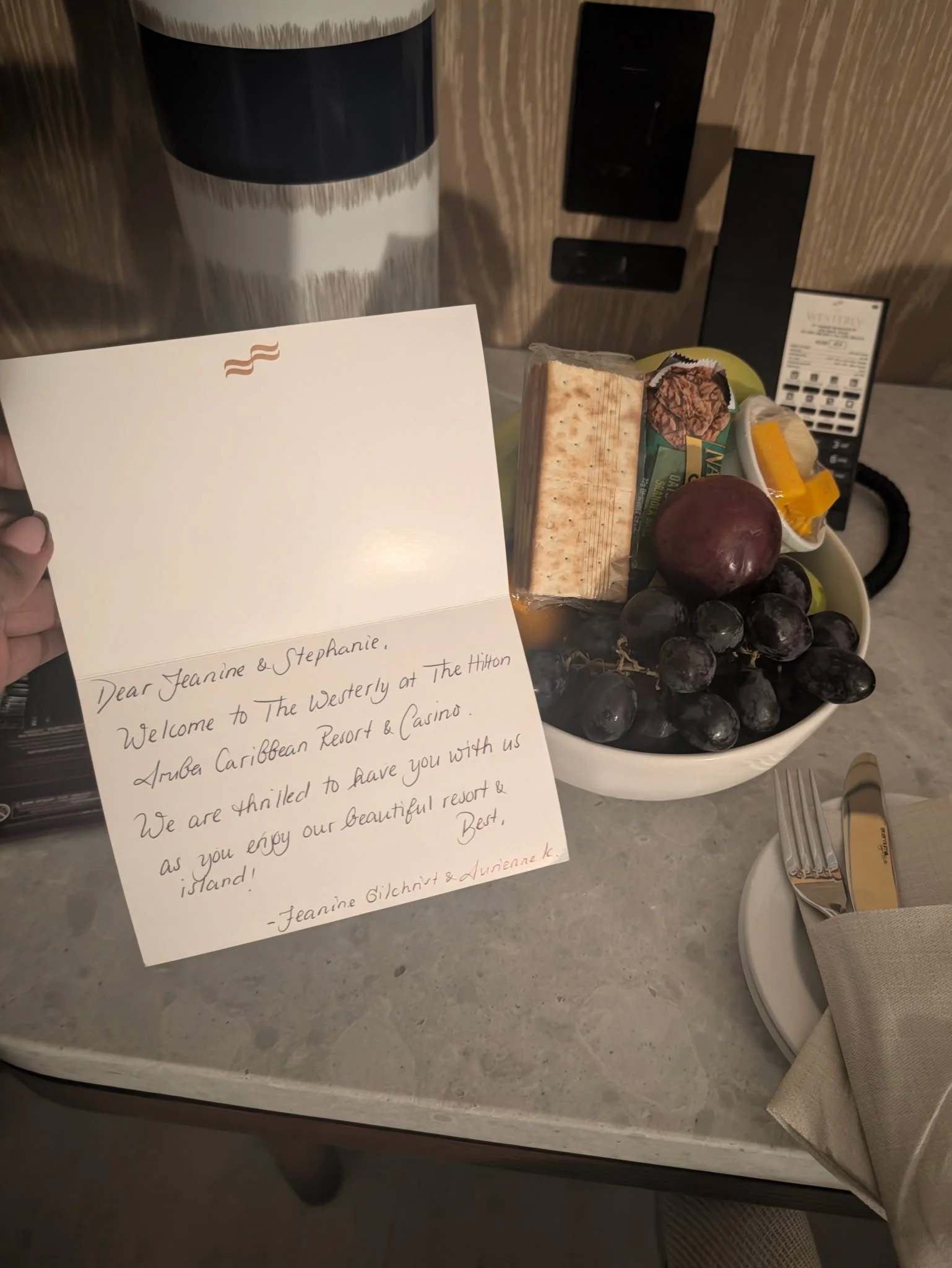 Welcome note and fresh fruit waiting in a guest room at The Westerly at Hilton Aruba