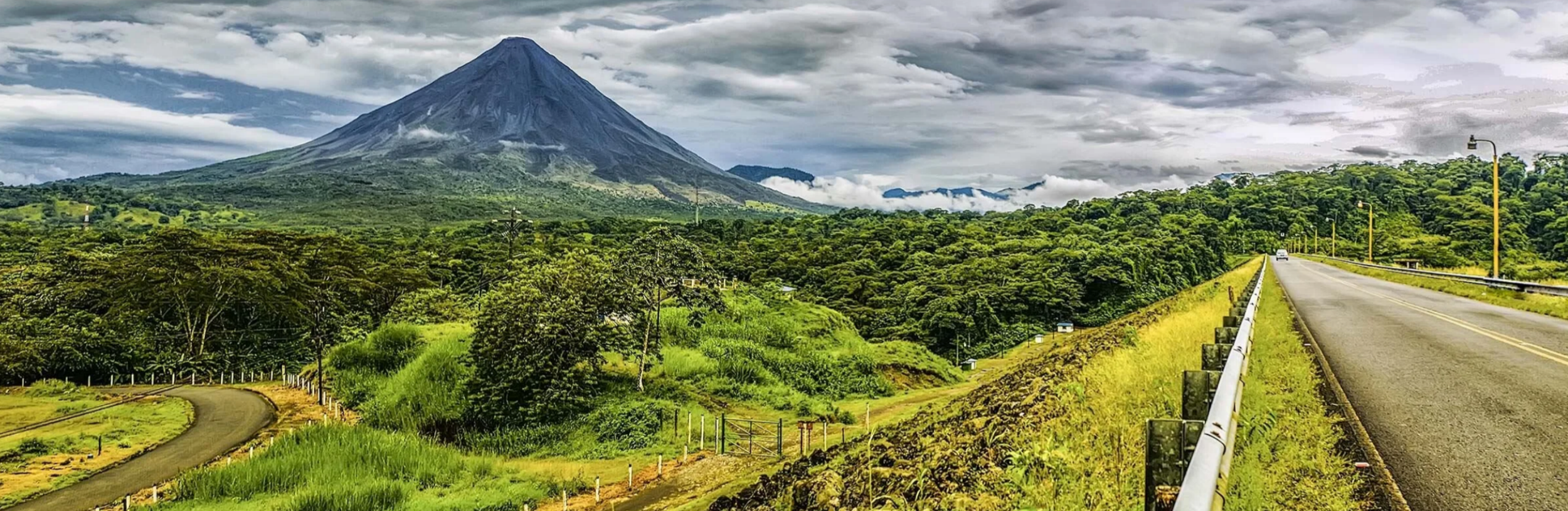 Experience the breathtaking view of Arenal Volcano in La Fortuna, Costa Rica. Explore scenic highways, lush rainforests, and unforgettable volcanic landscapes.