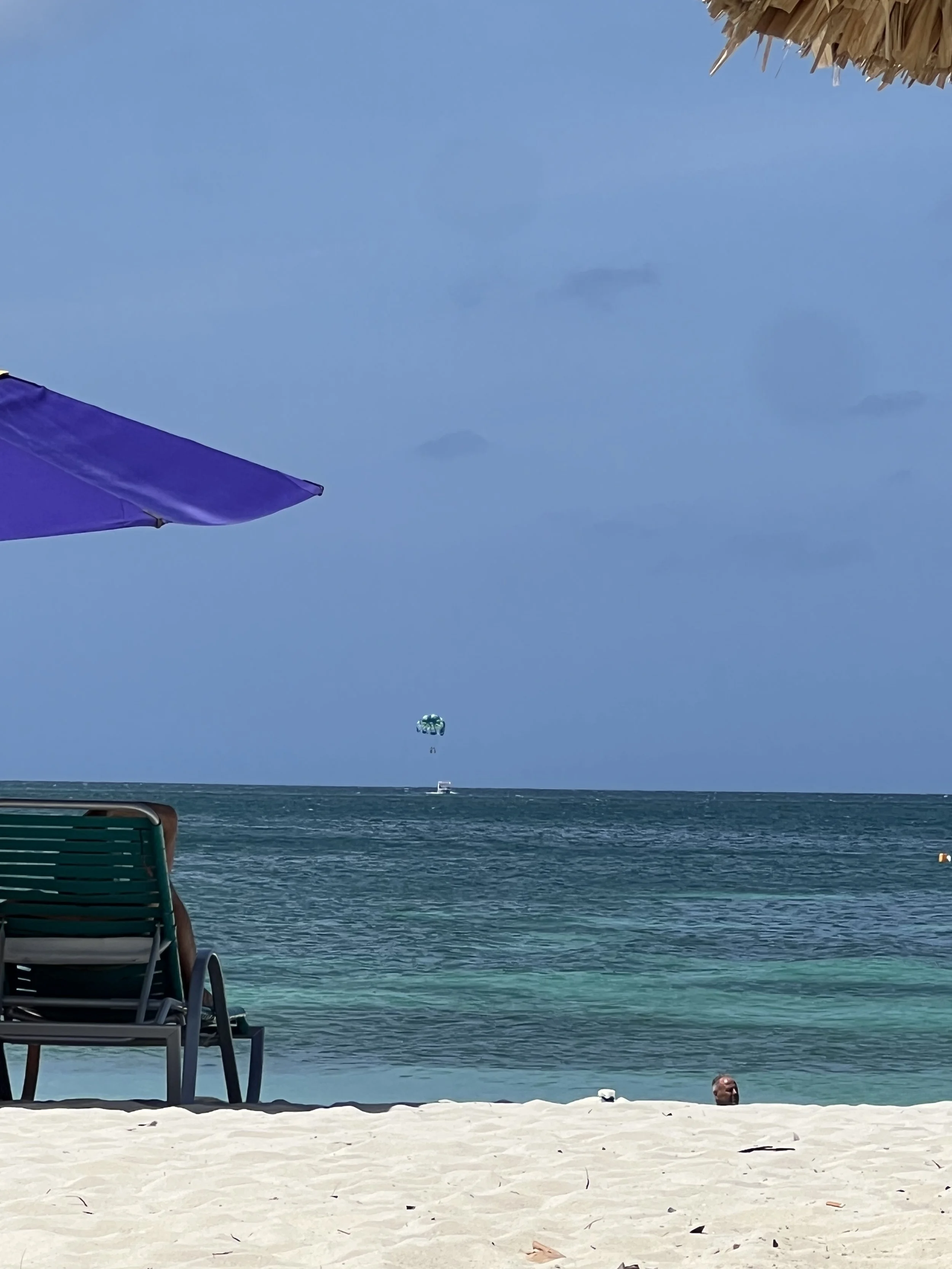 Beach chair facing calm, clear turquoise water in Aruba