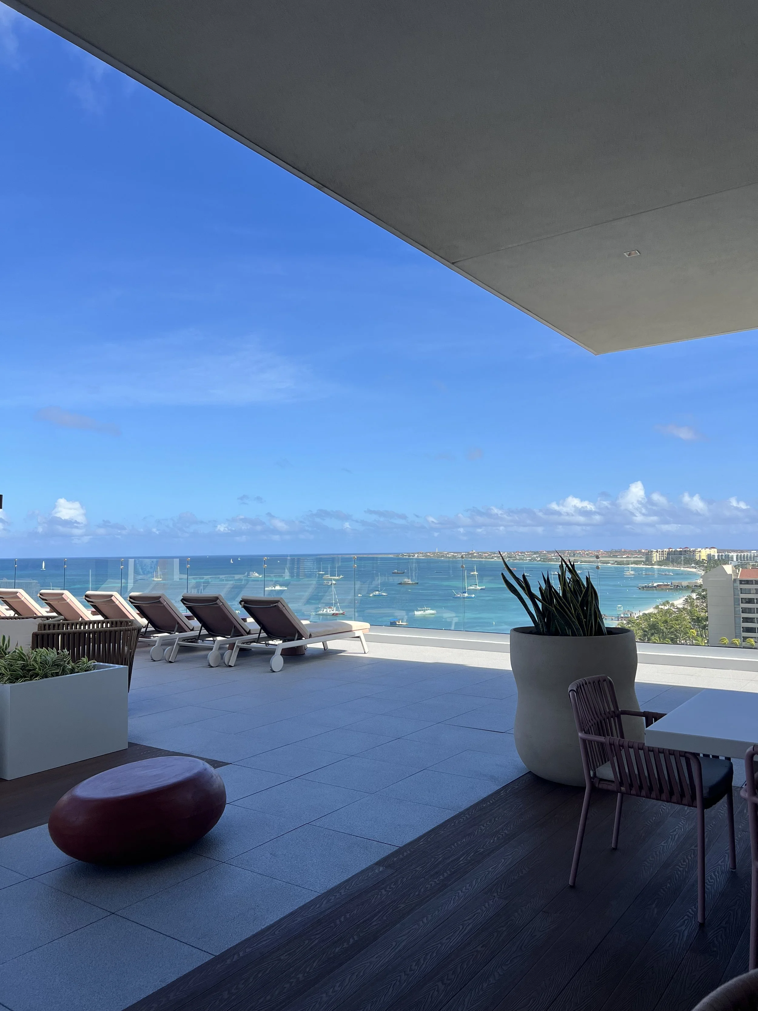 Shaded daybed overlooking the Caribbean Sea at Terrace on 10, the adults-only rooftop at The Westerly in Aruba