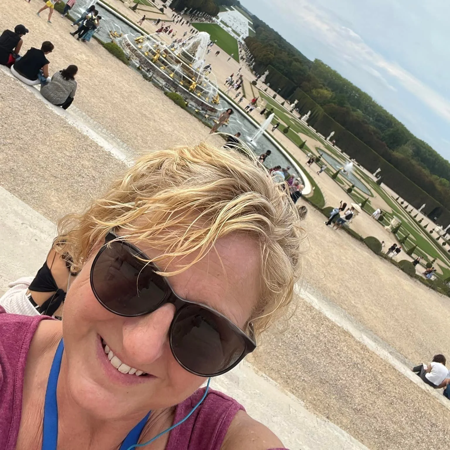 Travel specialist Jeanine on-site at a beautiful historic garden and fountain.