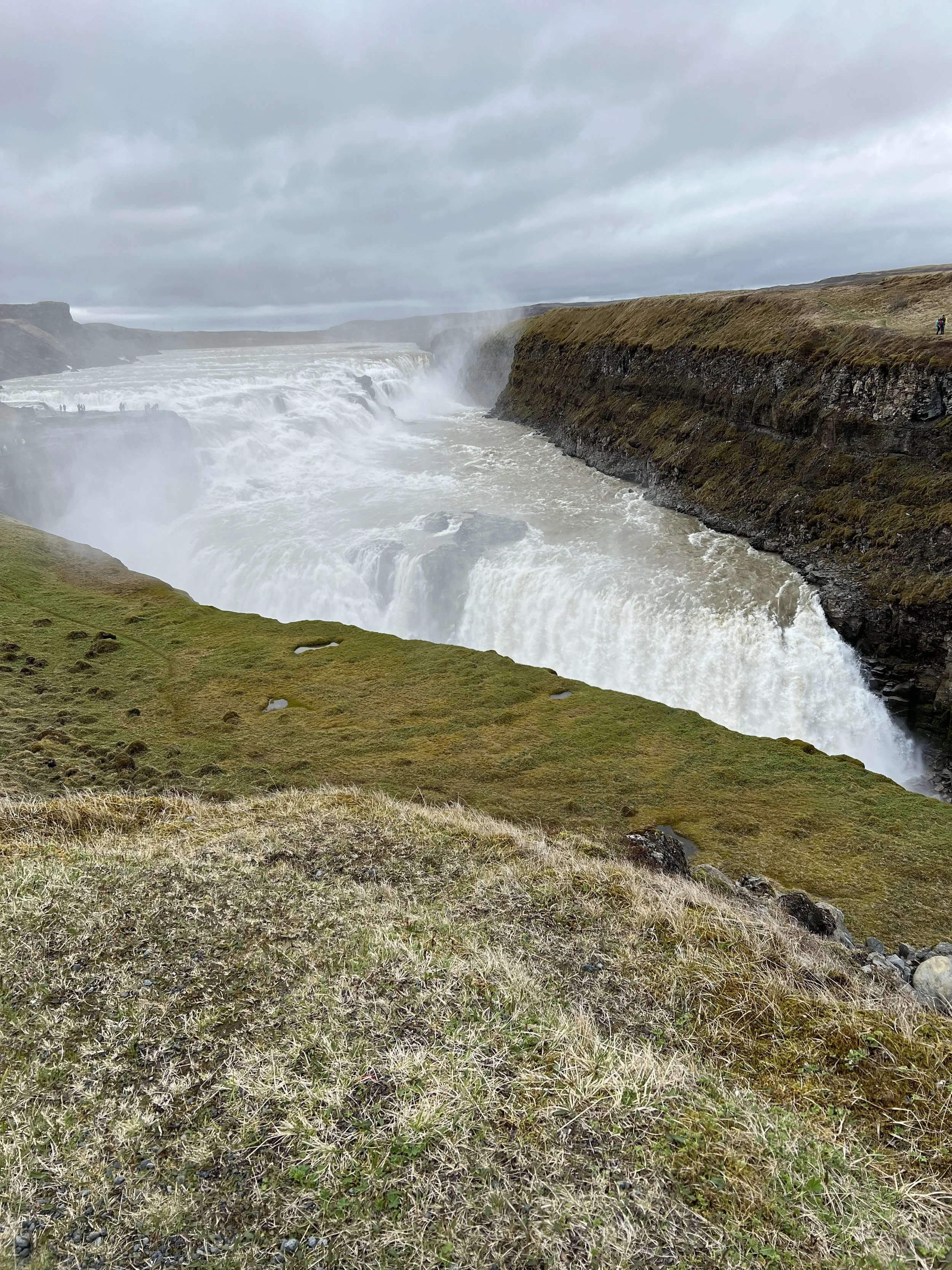 Powerful waterfall cascading into a rocky canyon on Jeanine’s Iceland trip