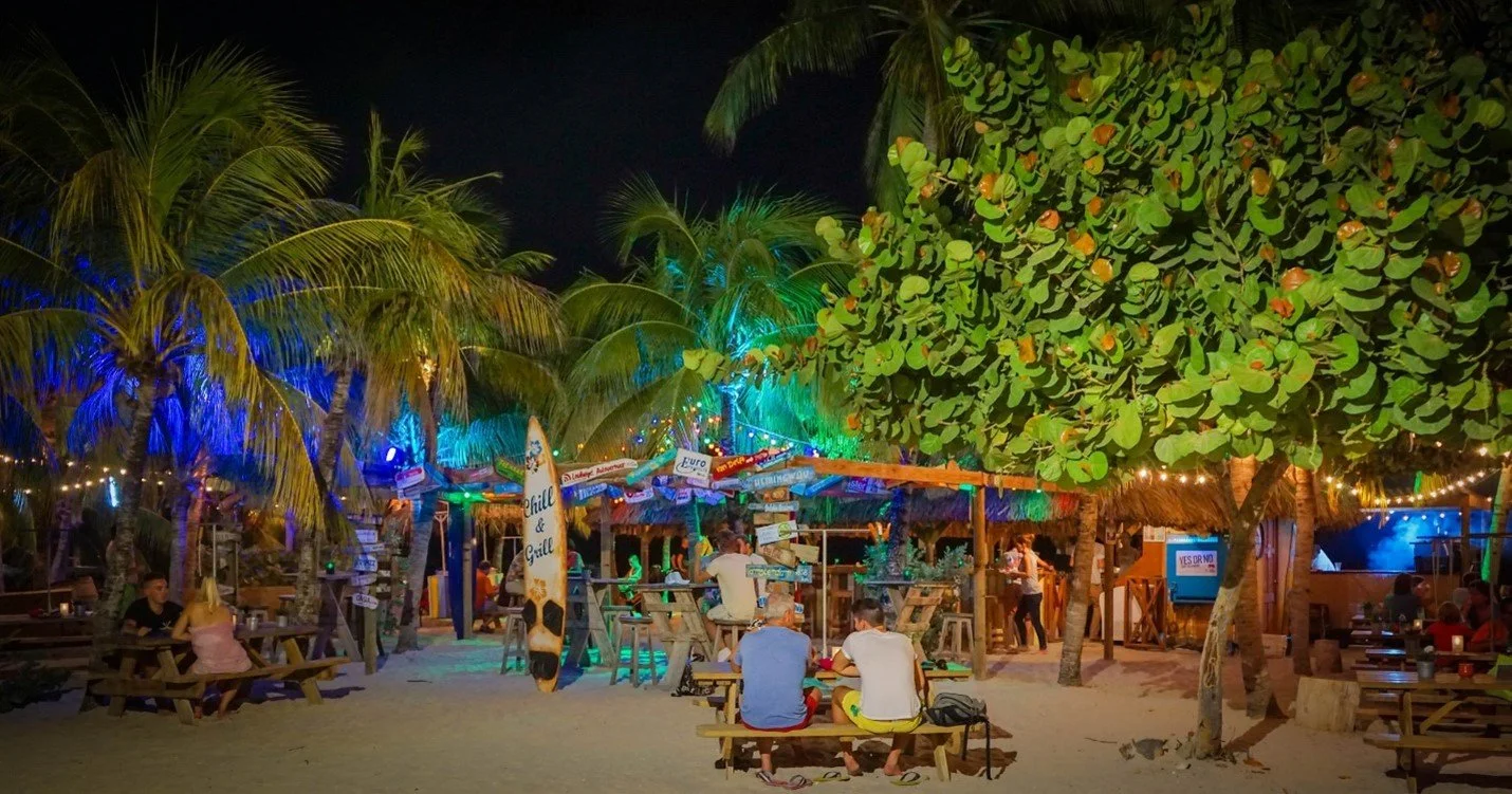 Beach bar lit up at night in Curaçao