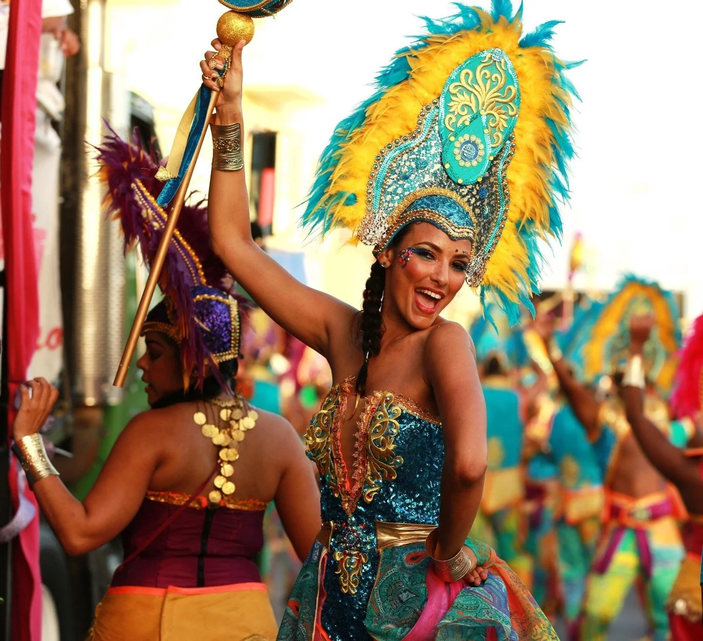 Carnival dancer in a colorful feathered costume in Curaçao