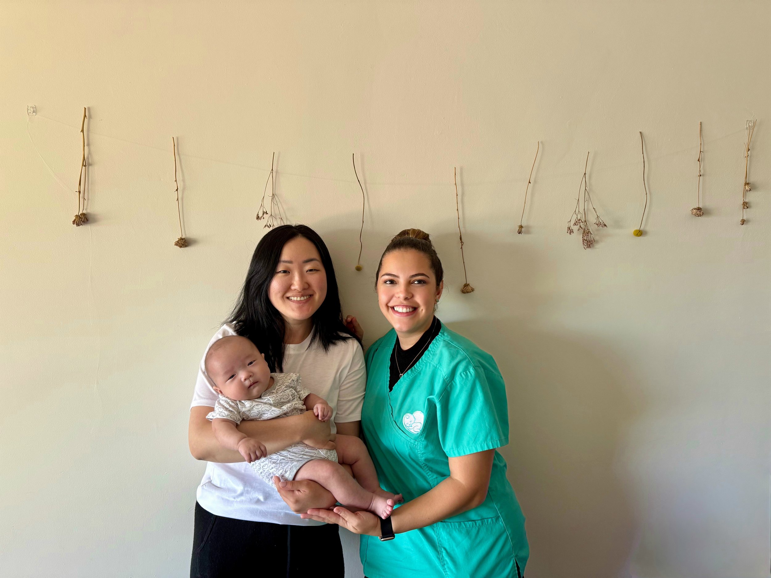 Asian mom with Doula and baby.JPG