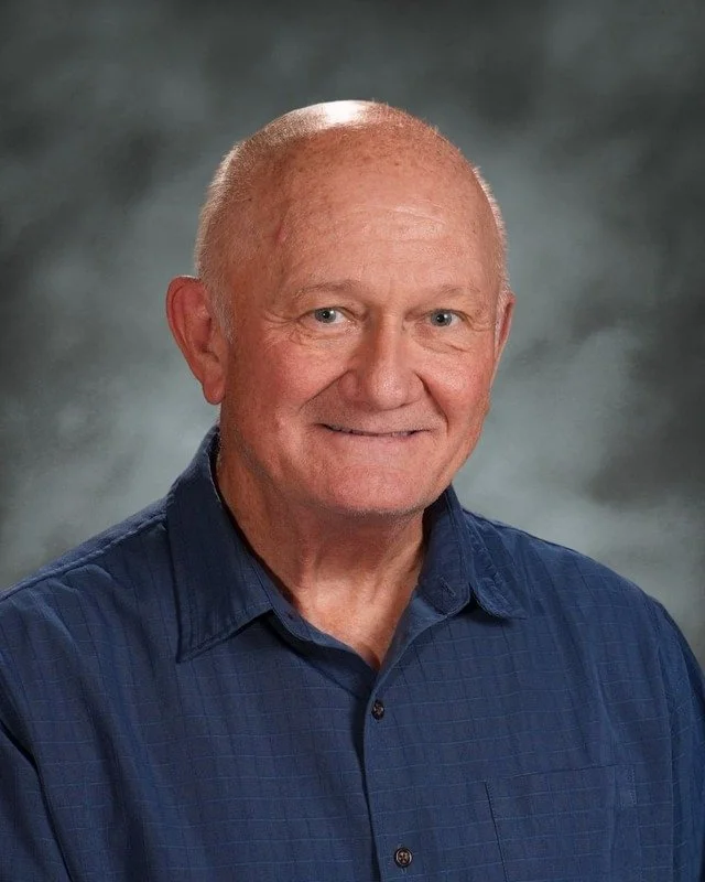 A school crest with religious symbols and a Latin motto, above the words "Coming Soon."