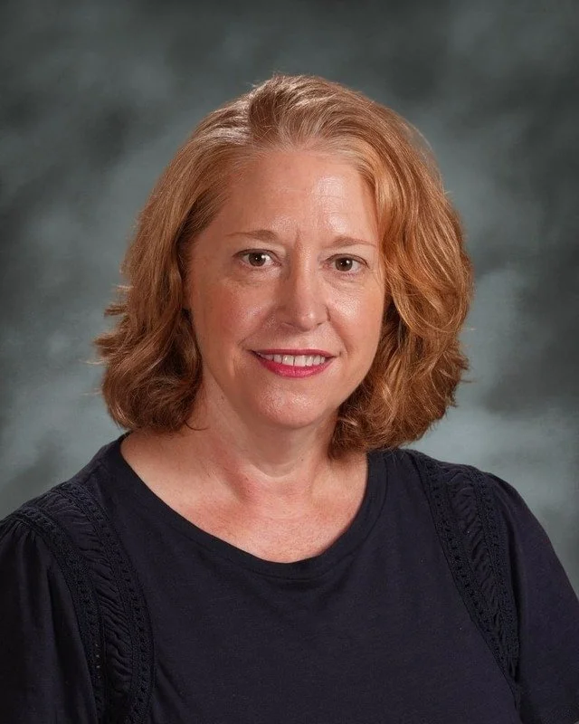 A school crest with religious symbols and a Latin motto, above the words "Coming Soon."