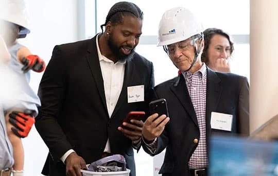 Two attendees at the VBRI Milestone ceremony.