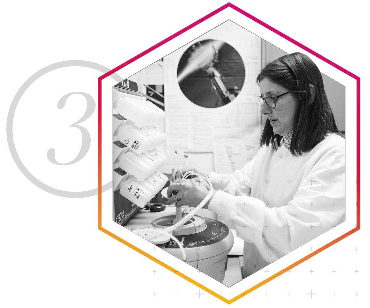 A technician conducts protein core sample testing.