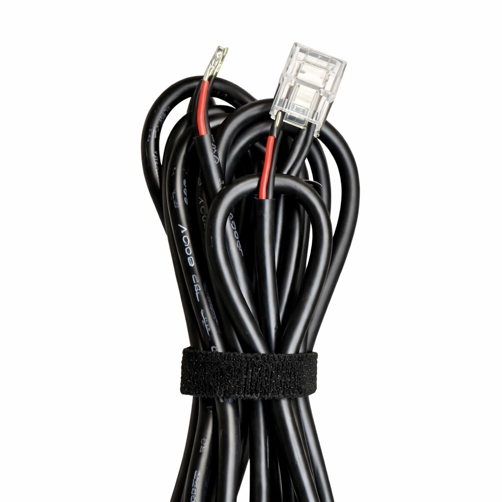 A bundle of black electrical wires secured with a Velcro strap, with one wire featuring a clear plastic connector.