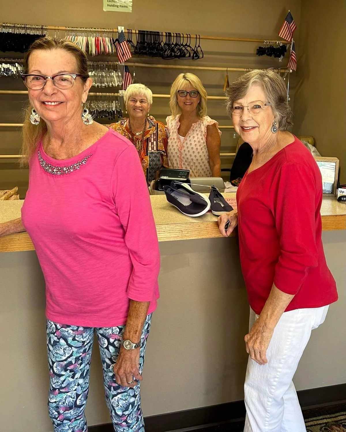 Volunteers behind the checkout counter at UpStart Thrift in Farmington, Arkansas