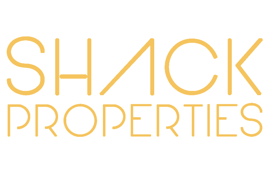 Text reading 'SHACK PROPERTIES' in gold letters on a black background.