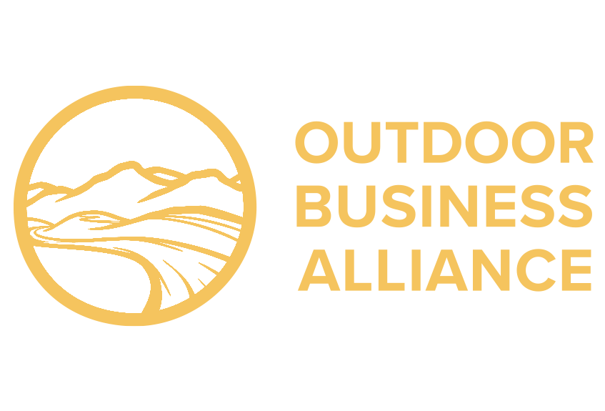 Logo of Outdoor Business Alliance featuring a gold mountain landscape within a circle and the organization's name in gold text to the right.