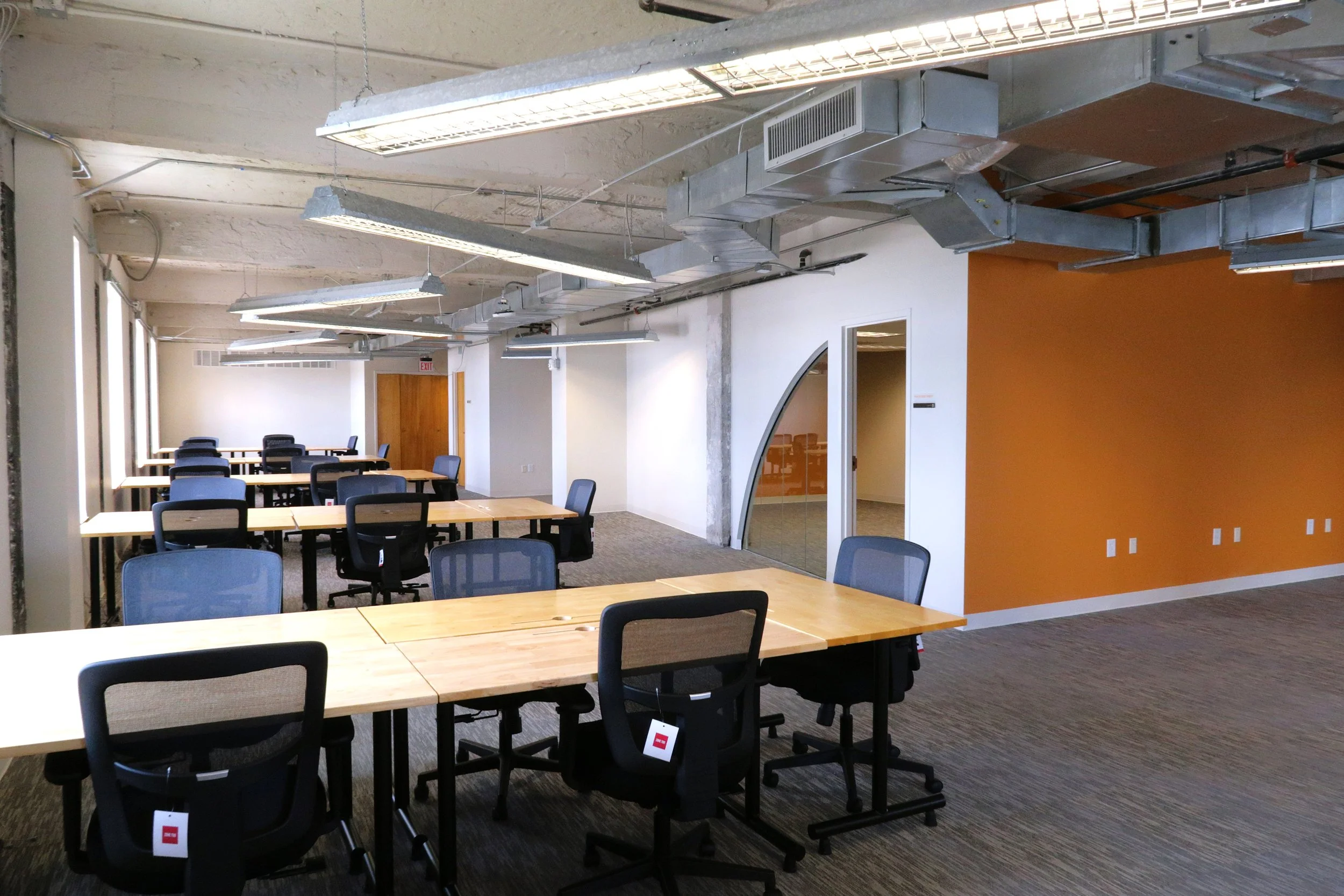 Suite 925, open workspace and conference room