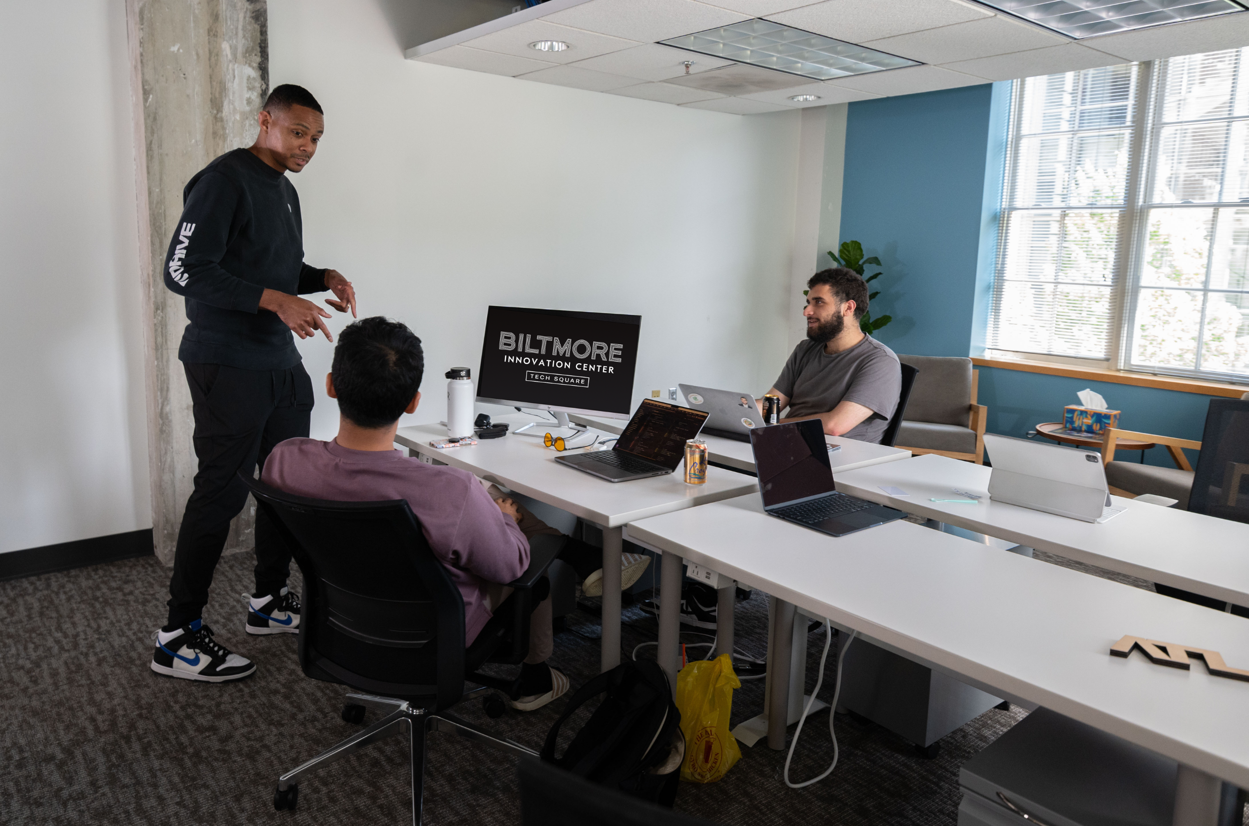 Men working in an office at the Biltmore Innovation Center.