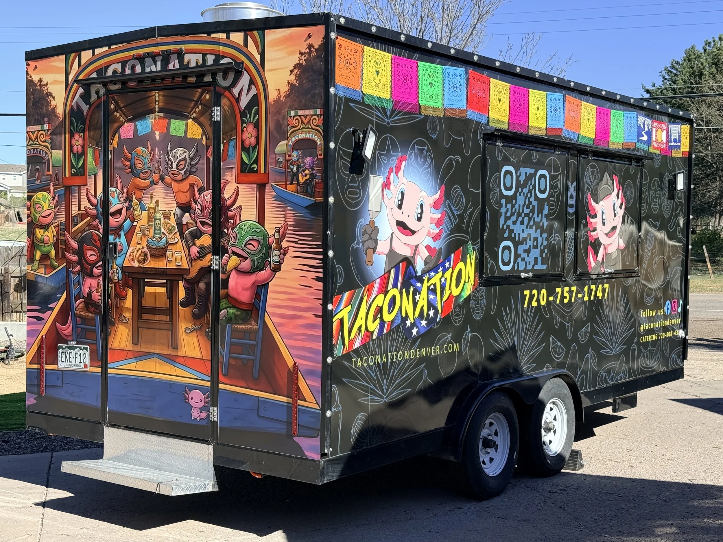 Colorful taco truck featuring Mexican-themed designs and cartoon characters enjoying drinks and music, parked outdoors.