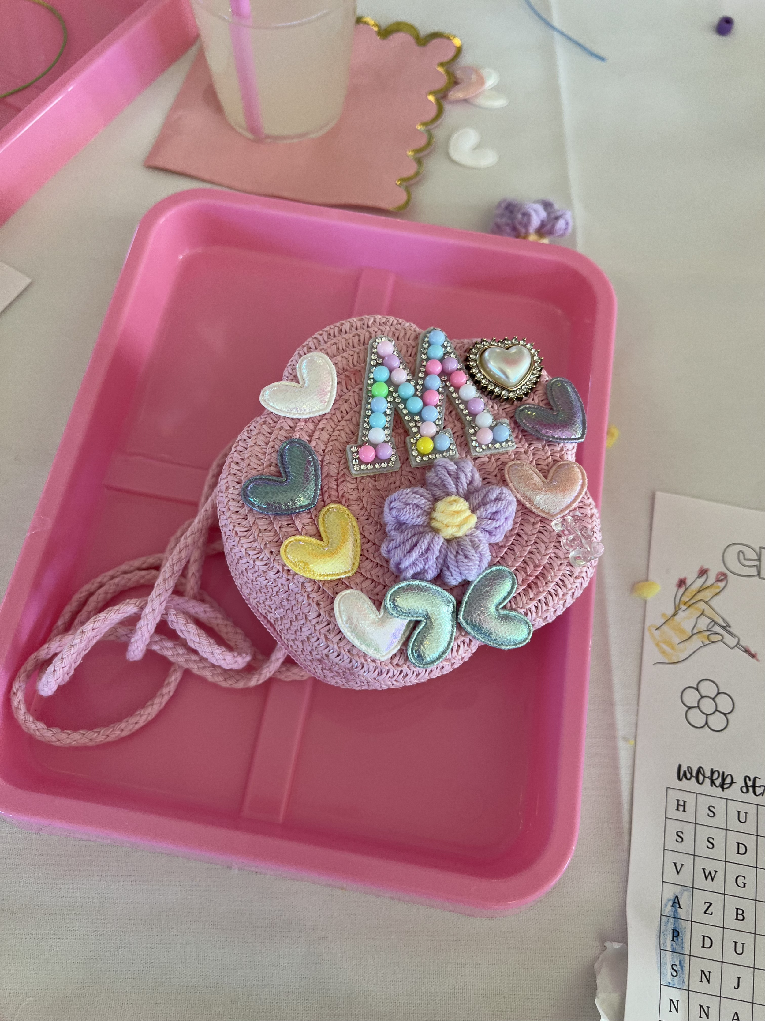 Luxury purse-decorating craft activity interactive entertainment station and spa glam bar station by Blush & Bliss by Mya with curated patches, gems, embellishments, and craft supplies. Ideal for girls’ birthday parties, Sweet Sixteens, Bat Mitzvahs,