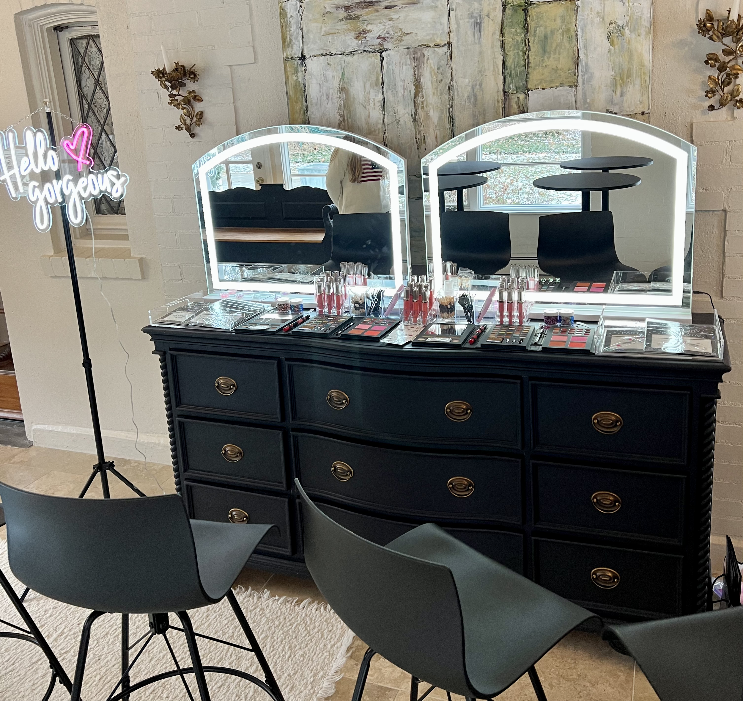 Luxury glam bar makeup station setup by Blush & Bliss by Mya featuring LED vanity mirrors, custom lip gloss station, and professional makeup displays for an upscale kids birthday party, sweet 16, or Bat Mitzvah in Lake Forest, Wilmette, the Chicago N