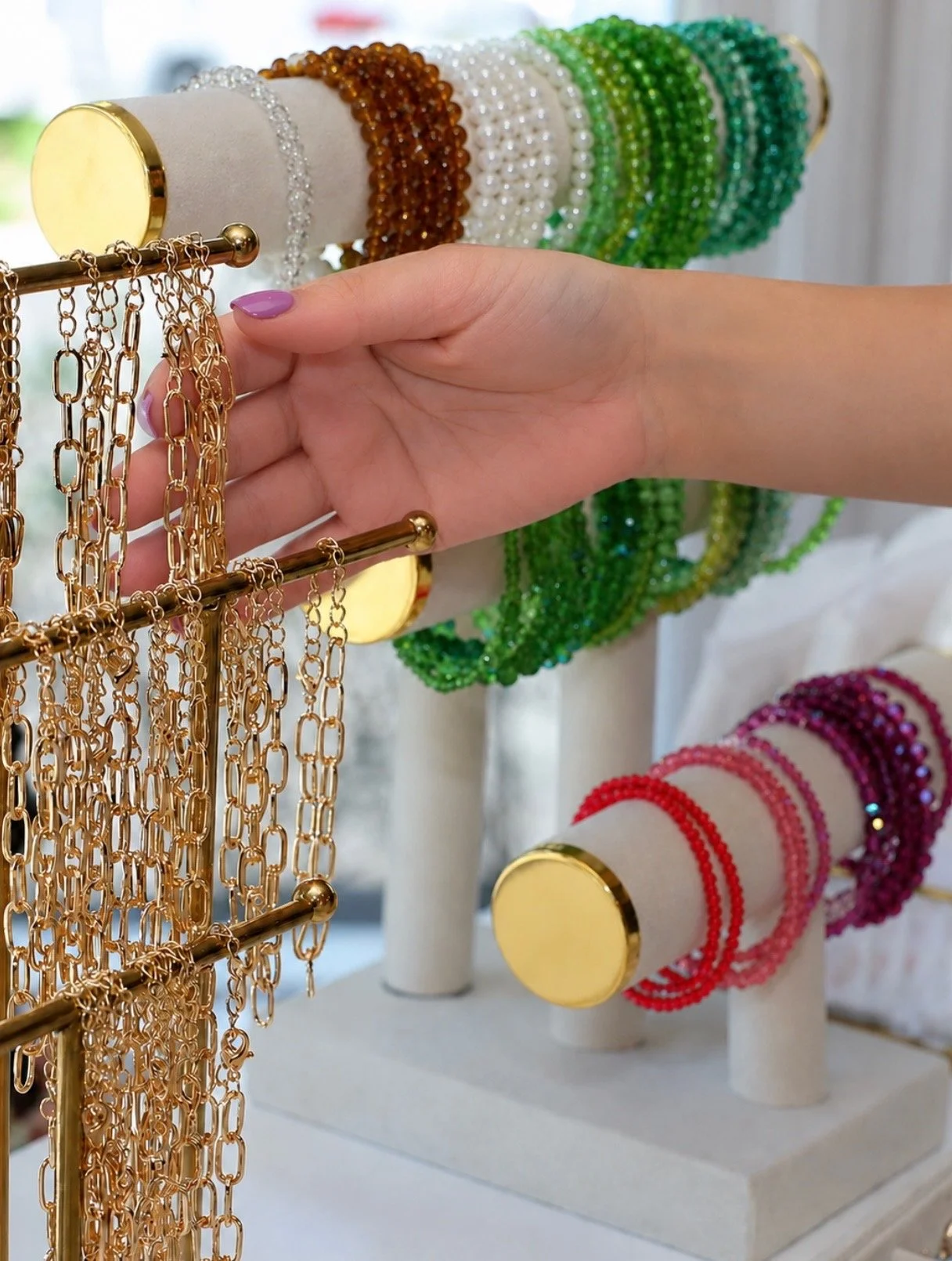 Custom bracelet making Charm Bar by Blush & Bliss by Mya — an interactive entertainment station for events where guests design their own charm bracelets to take home as the perfect Bat Mitzvah party favor in Chicago and North Shore suburbs.