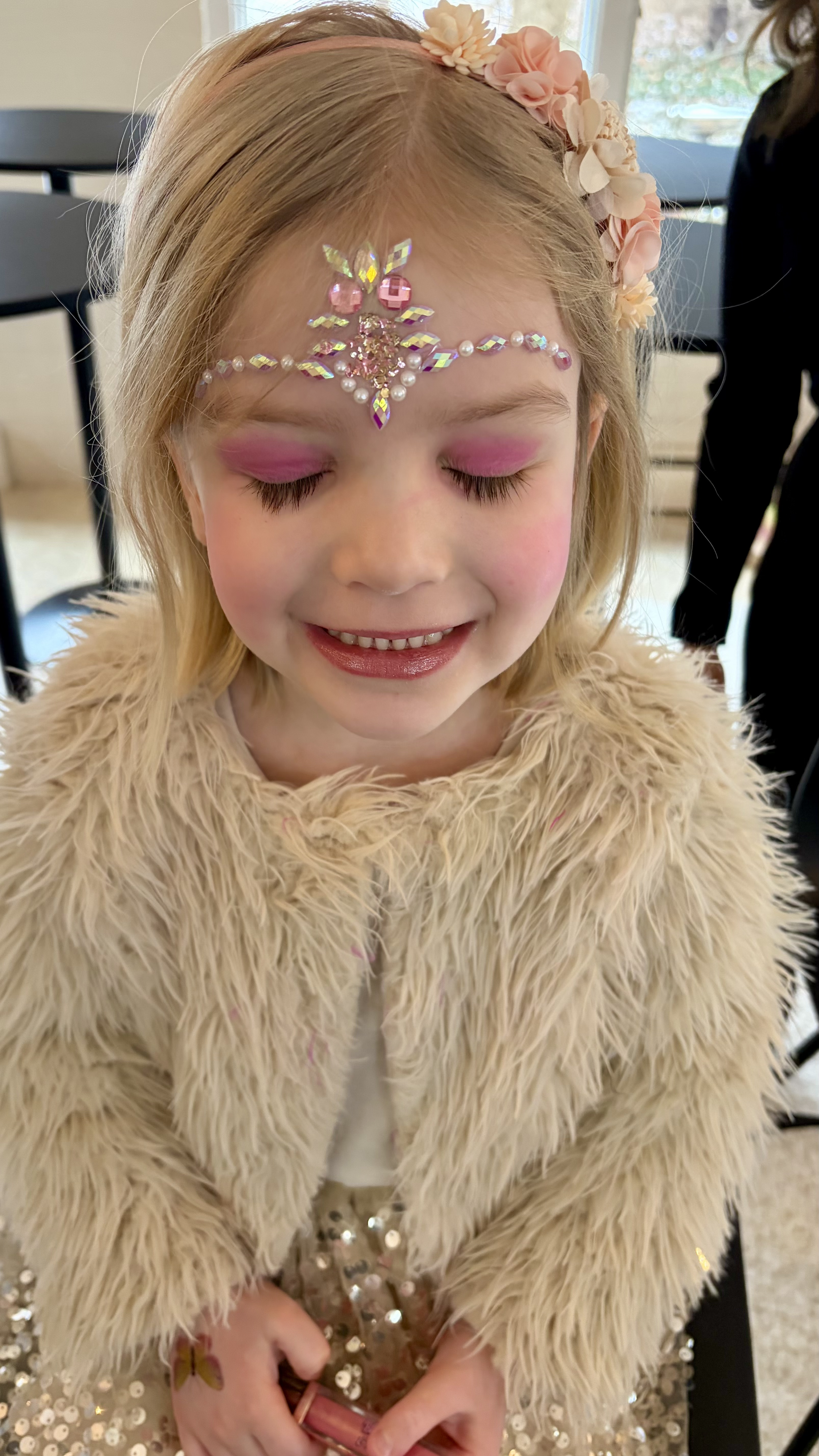Close-up of a luxury glam bar experience in Lake Forest by Blush & Bliss by Mya featuring soft pink eyeshadow makeup, crystal face gems, lip gloss, and a chic party look for an upscale birthday celebration, sweet 16s, bat mitzvahs, and more.