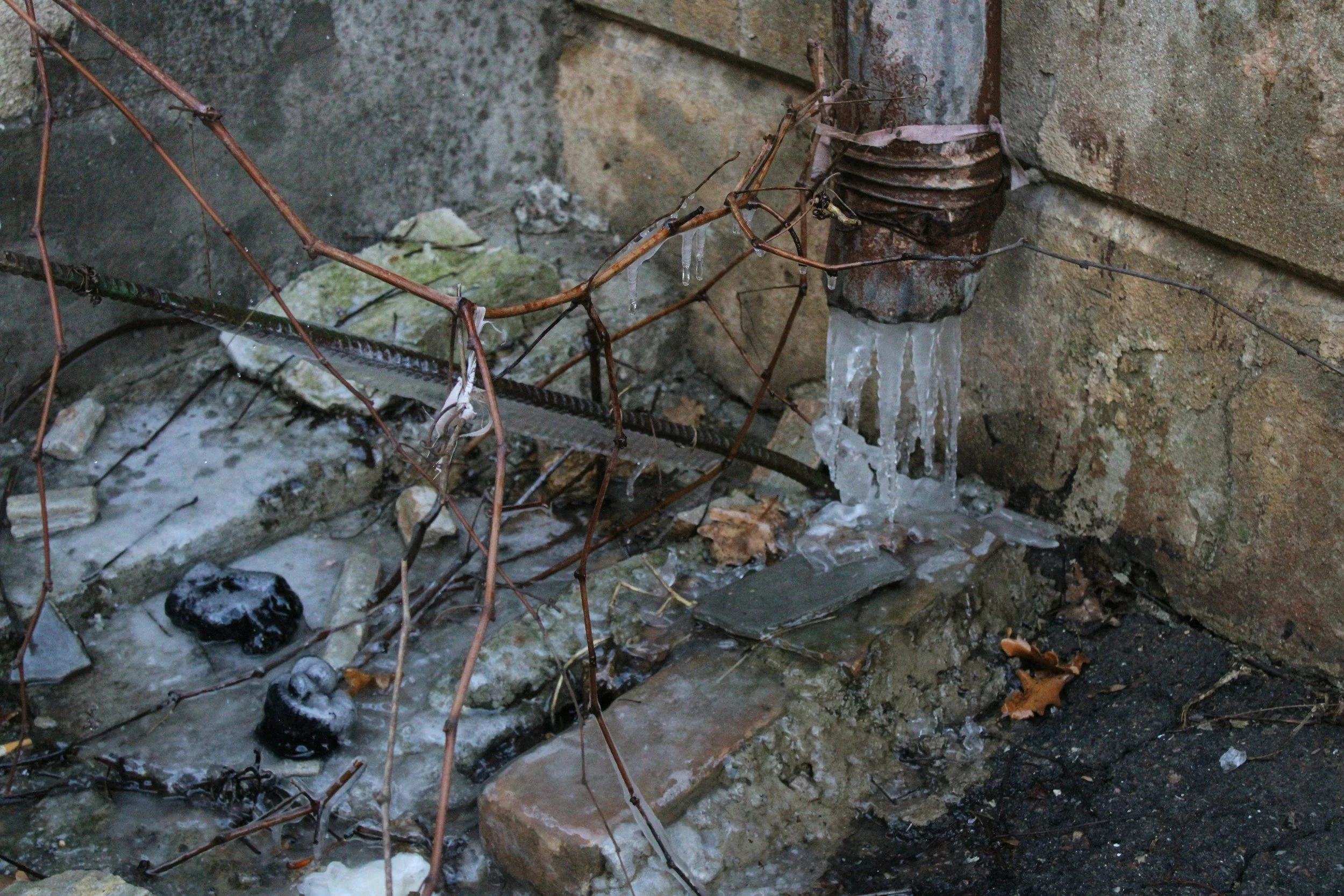 Winter water damage from frozen pipes revealing insurance coverage gaps