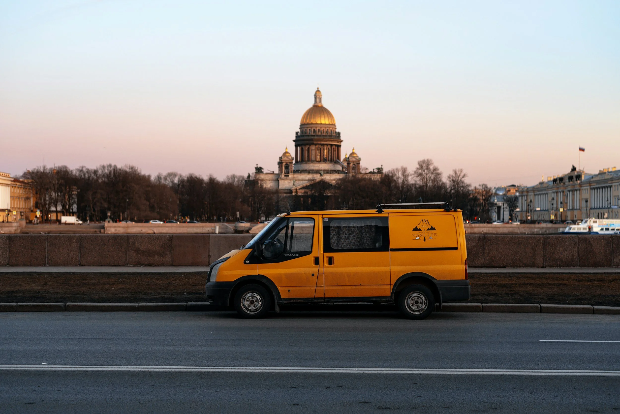 Passenger van parked outside a church building