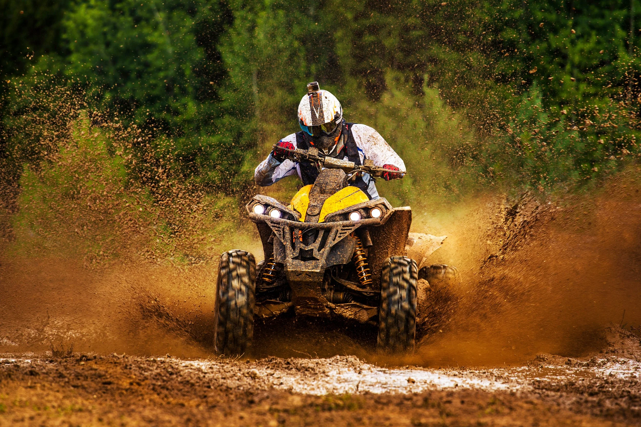 ATV with safety equipment and helmet emphasizing proper riding preparation