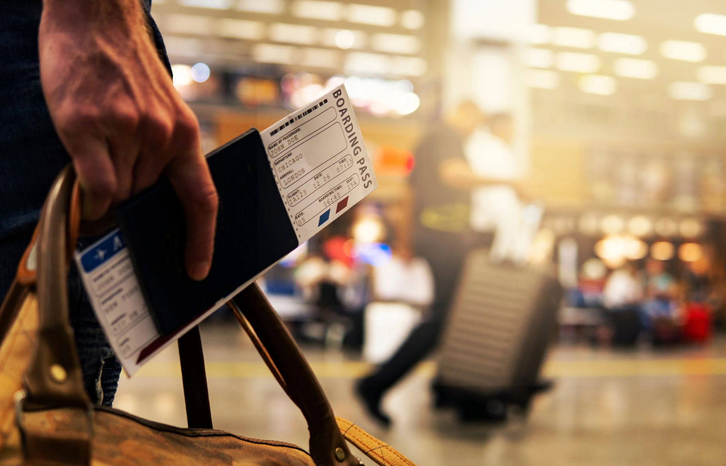Receipts, boarding passes, and a passport organized on a table for a travel insurance claim.