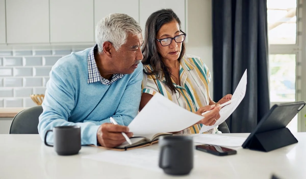 Homeowner reviewing insurance paperwork where optional endorsements are often overlooked