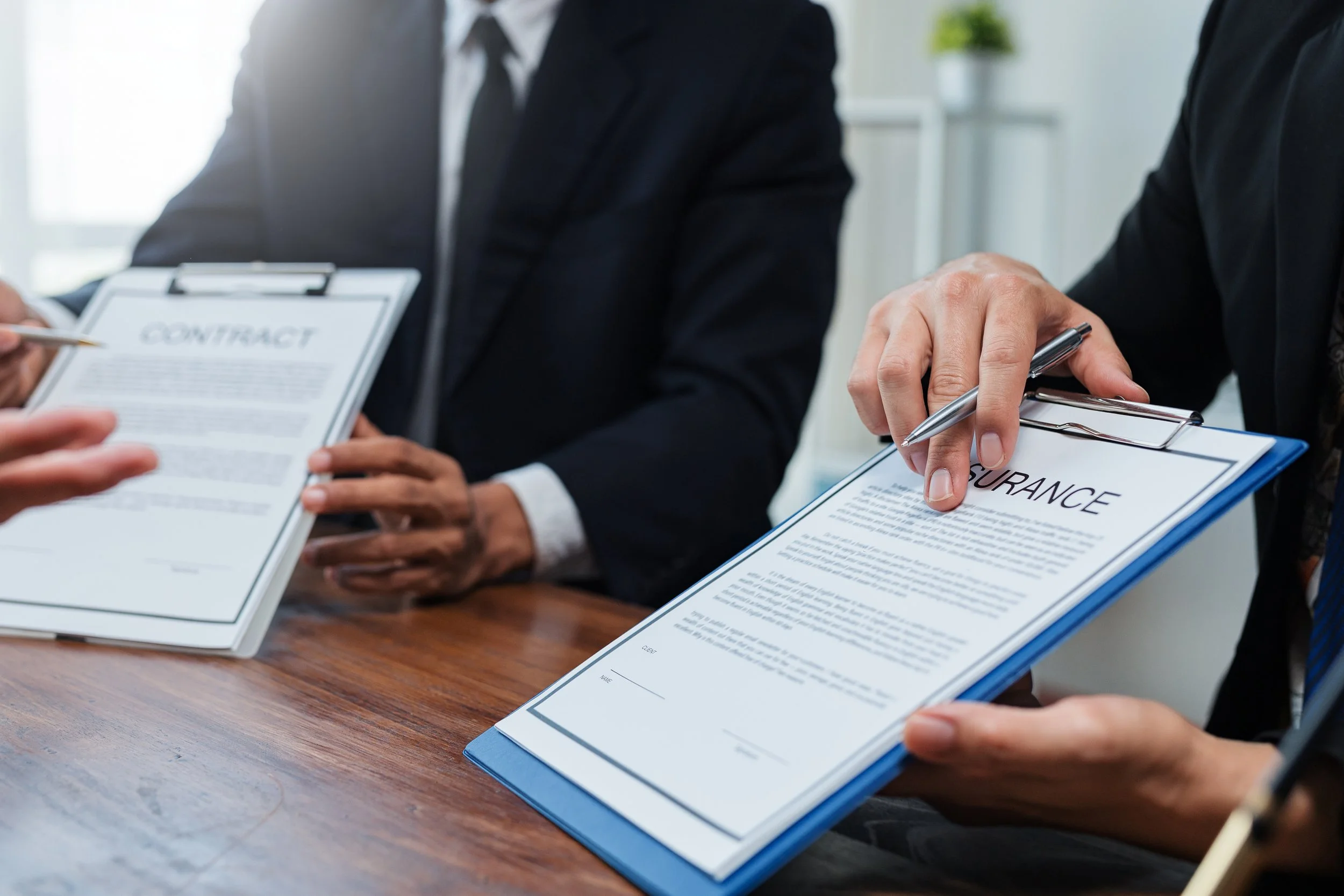 Insurance agent reviewing policy details and payment options with a homeowner.