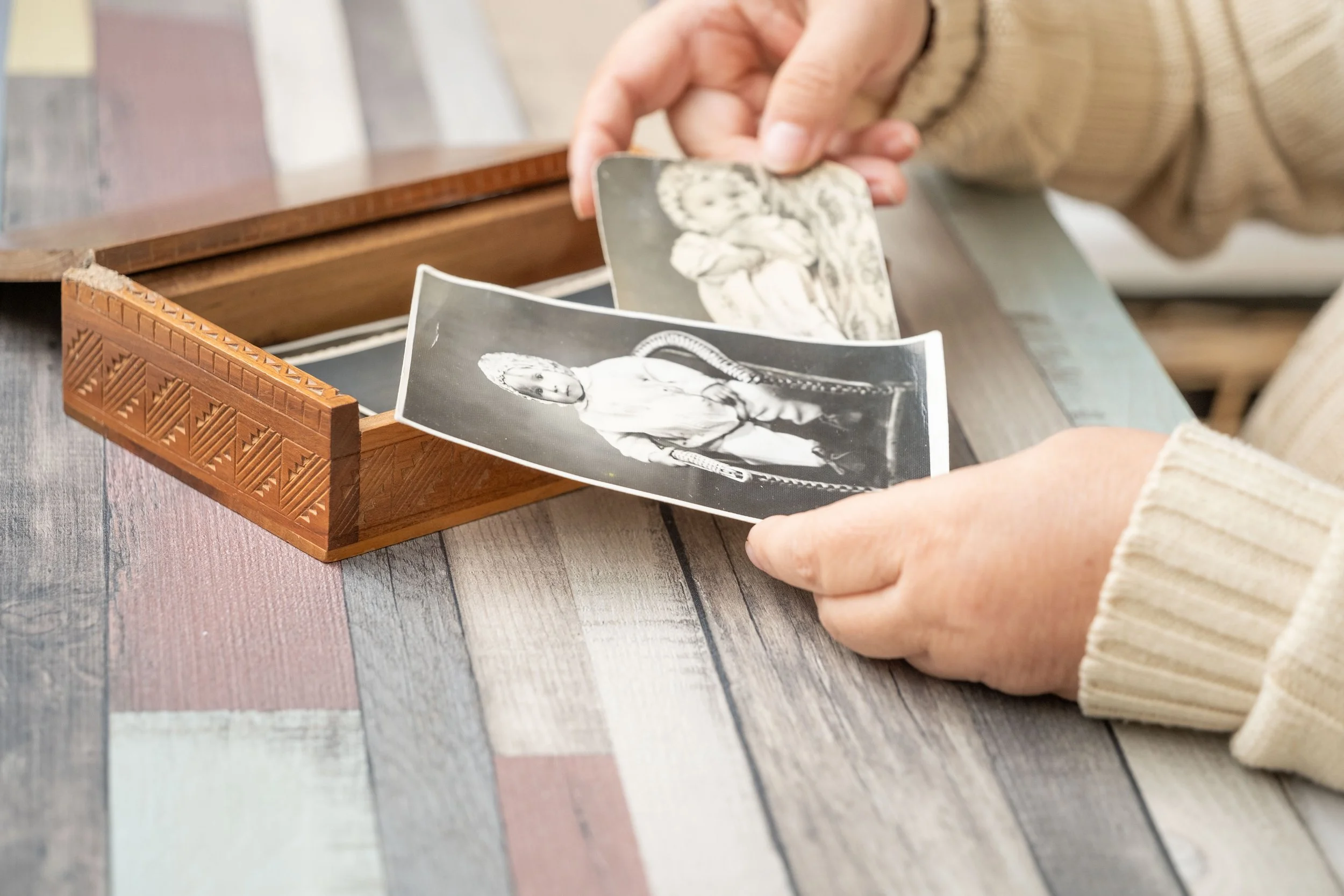 Family heirloom jewelry being passed down as a graduation gift in a presentation box
