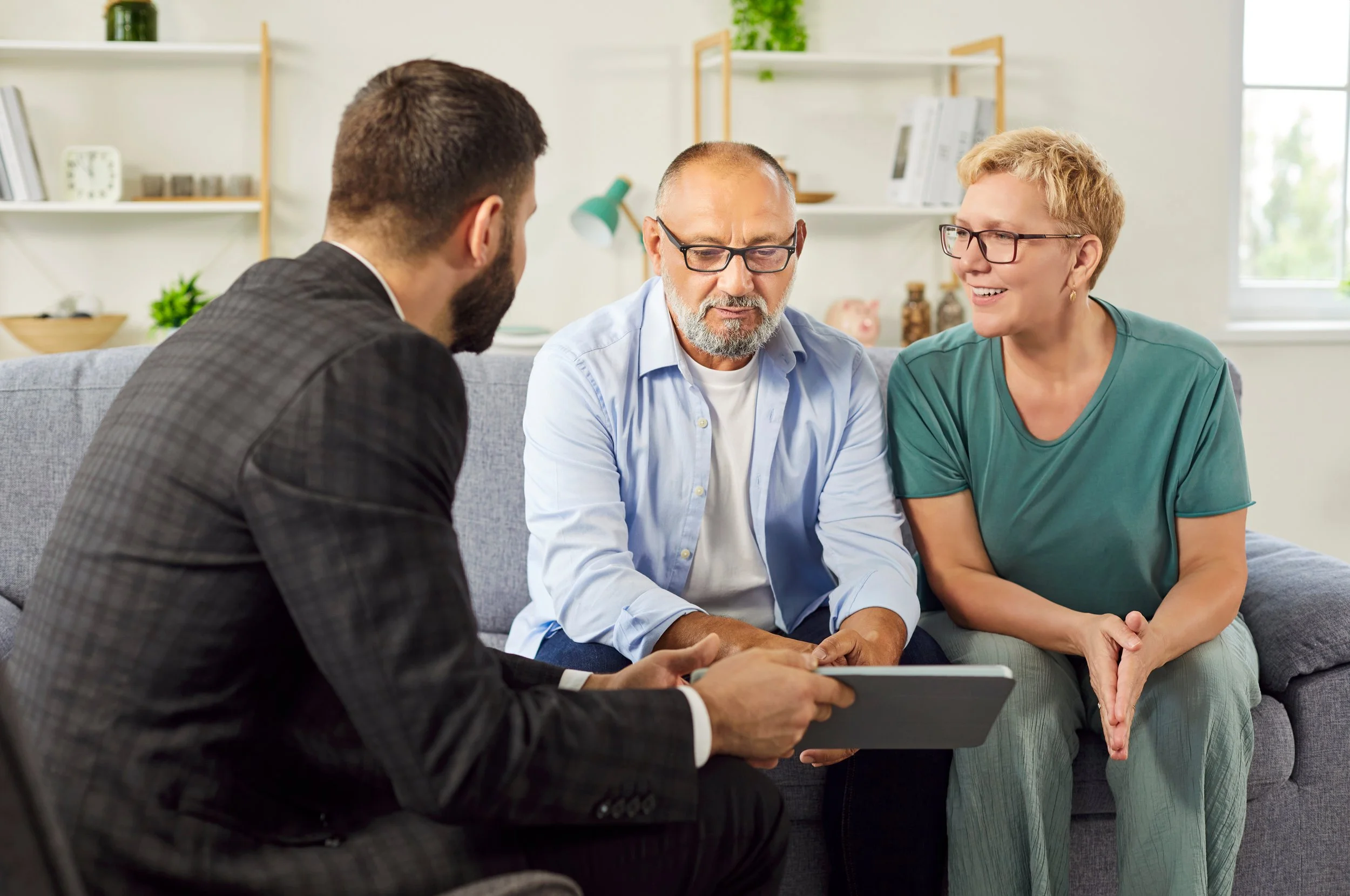 Insurance agent helping a client choose between high and low deductible options