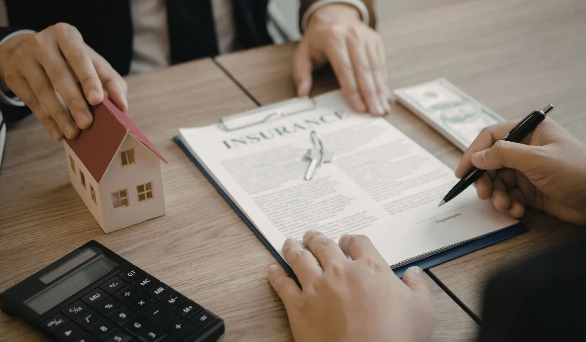 Homeowner reviewing insurance policy documents related to identity theft coverage