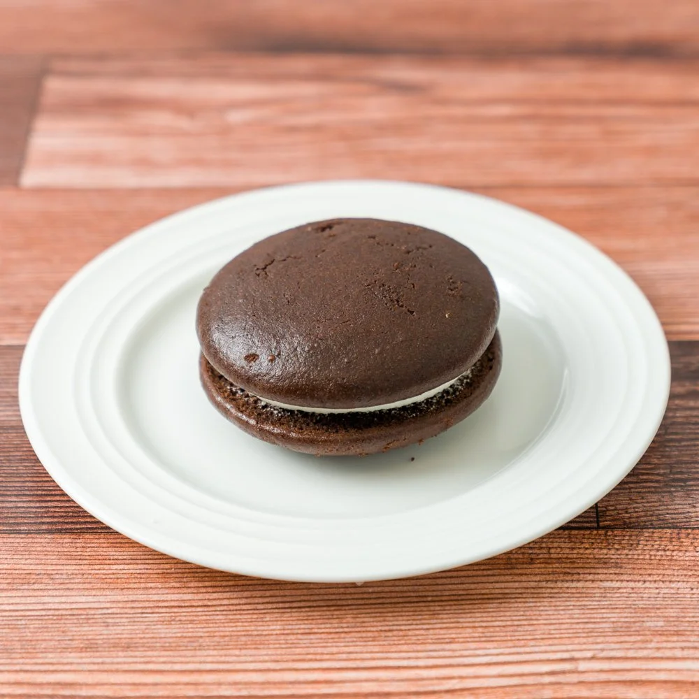 sweet, creamy filling sandwiched between  two chocolatey cake-like cookies